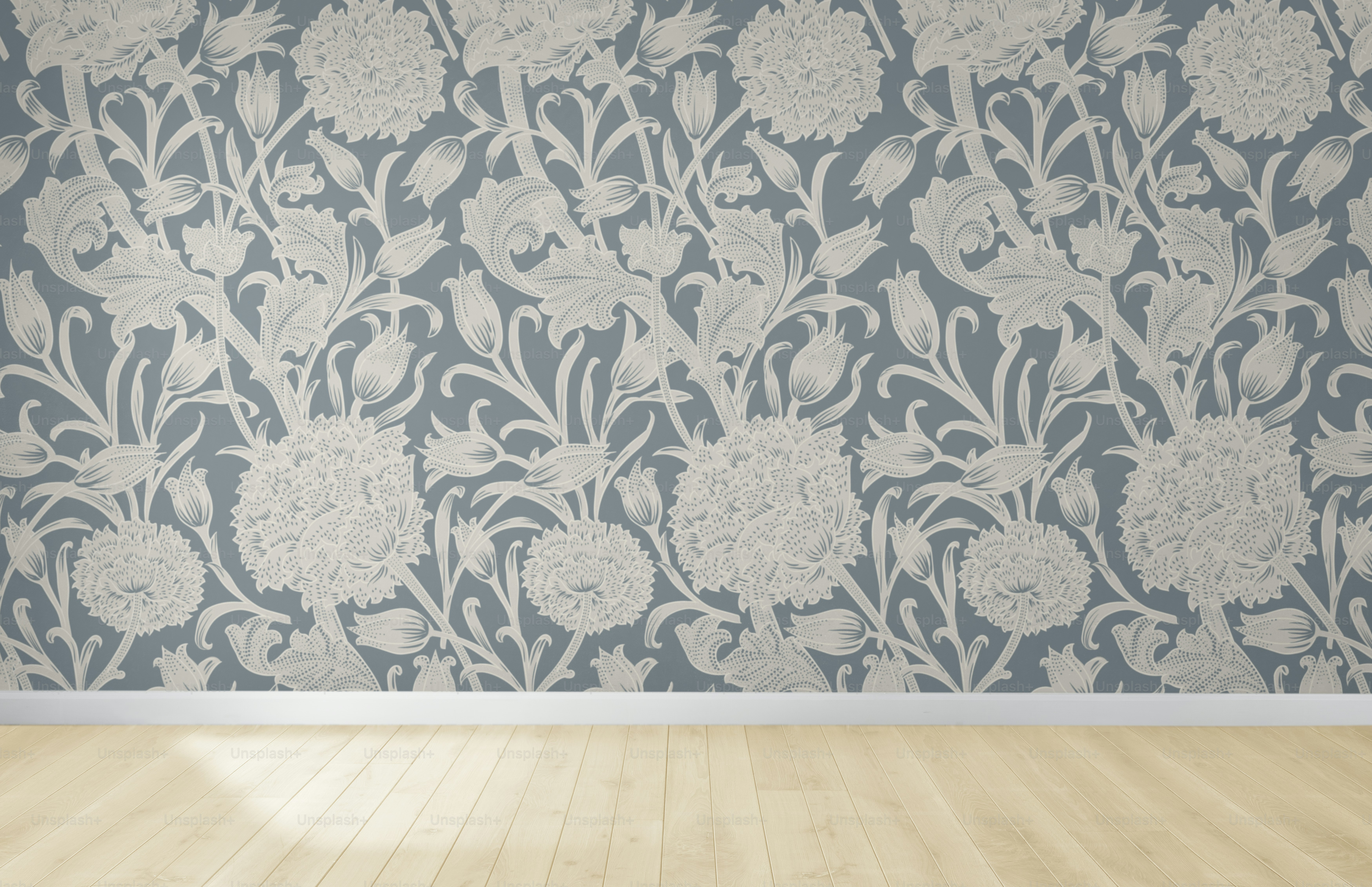 Floral wallpaper in an empty room with wooden floor
