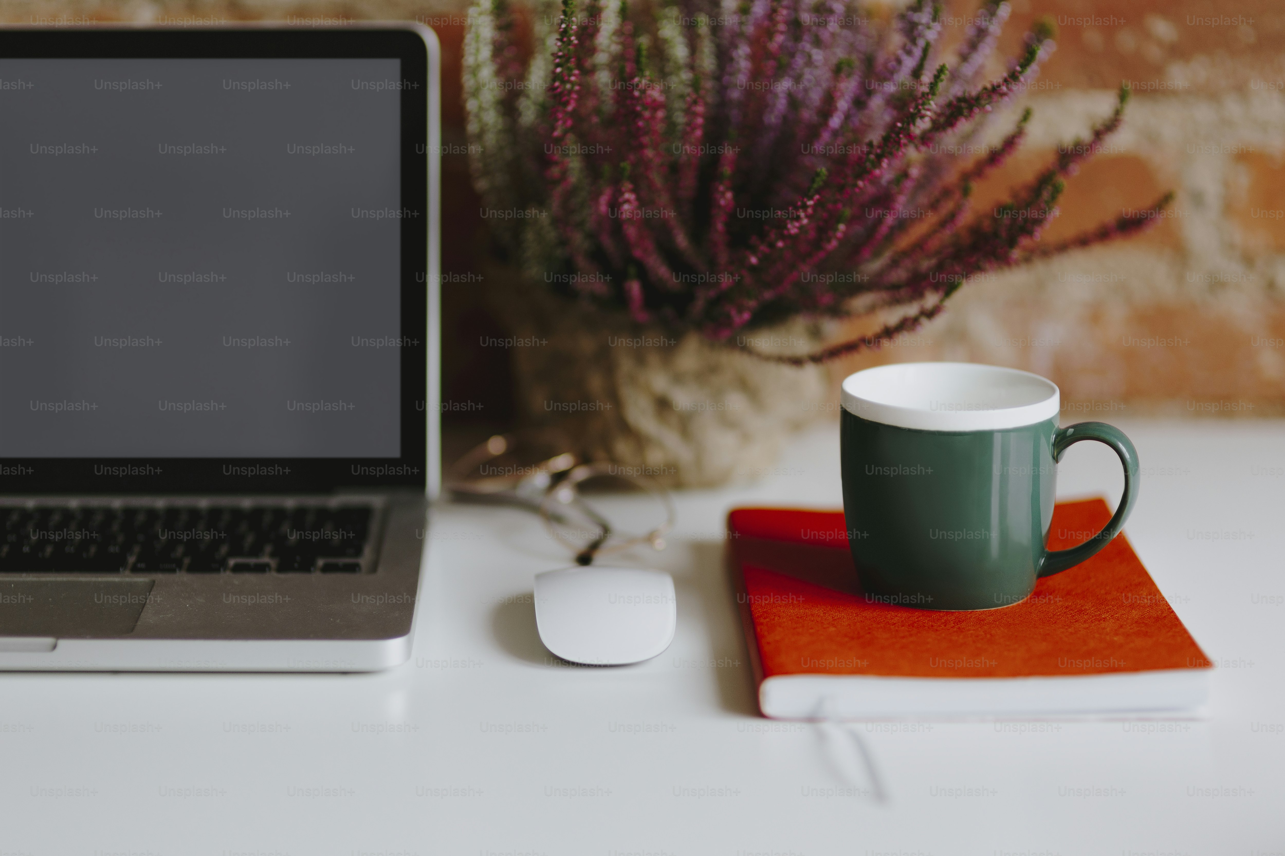 Laptop on a table with a coffee mug
