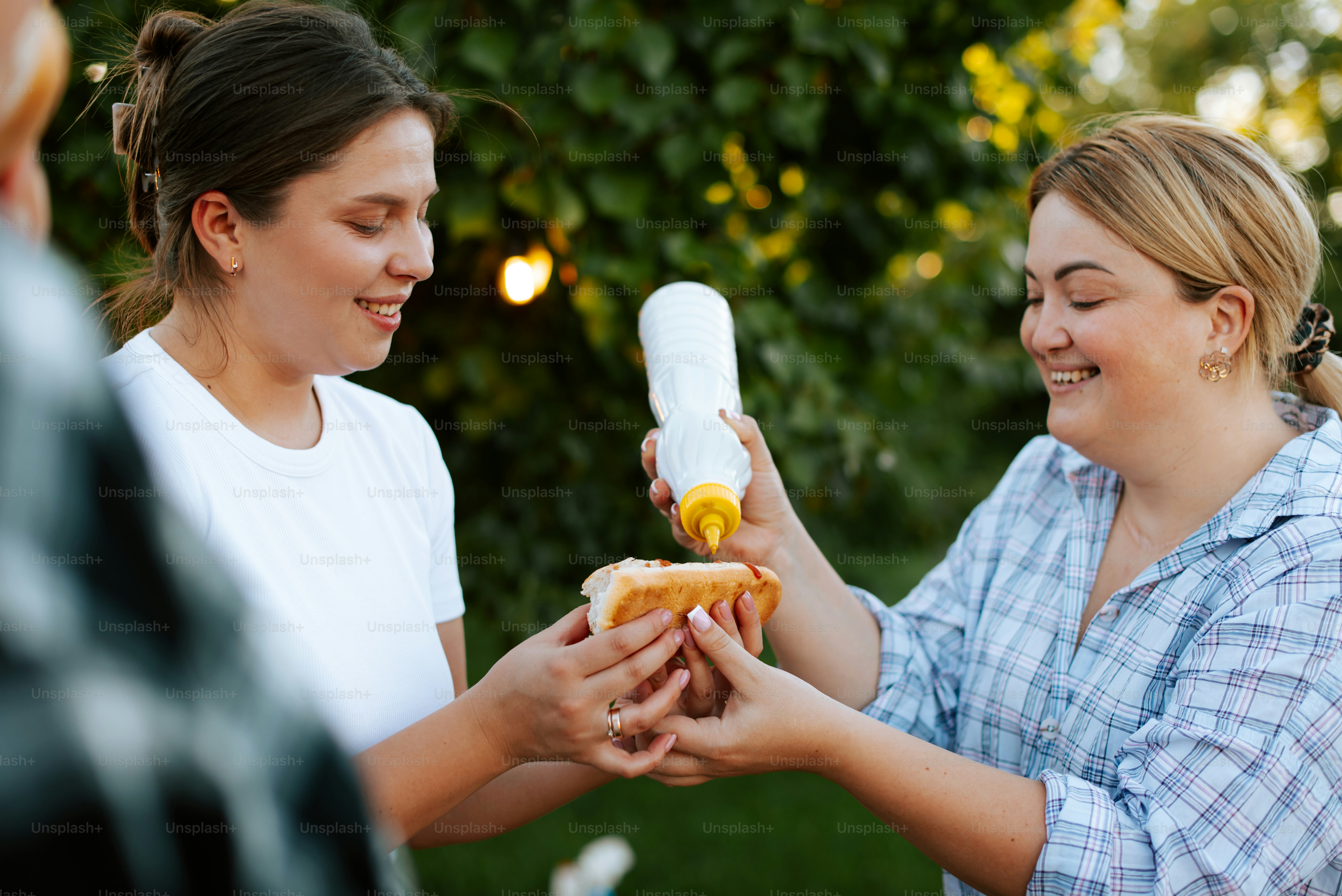 A group of people standing around each other