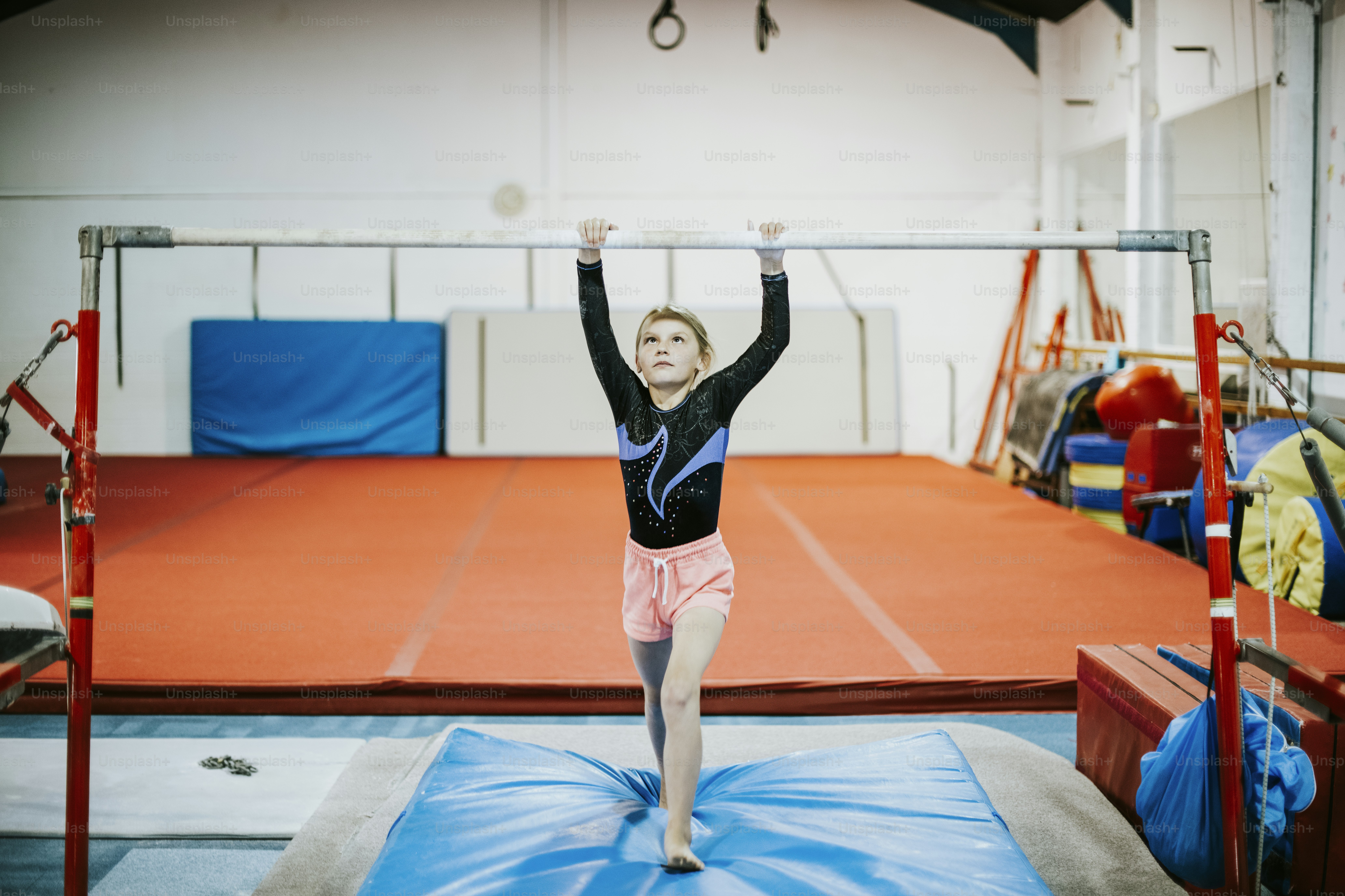Young gymnast on a horizontal bar