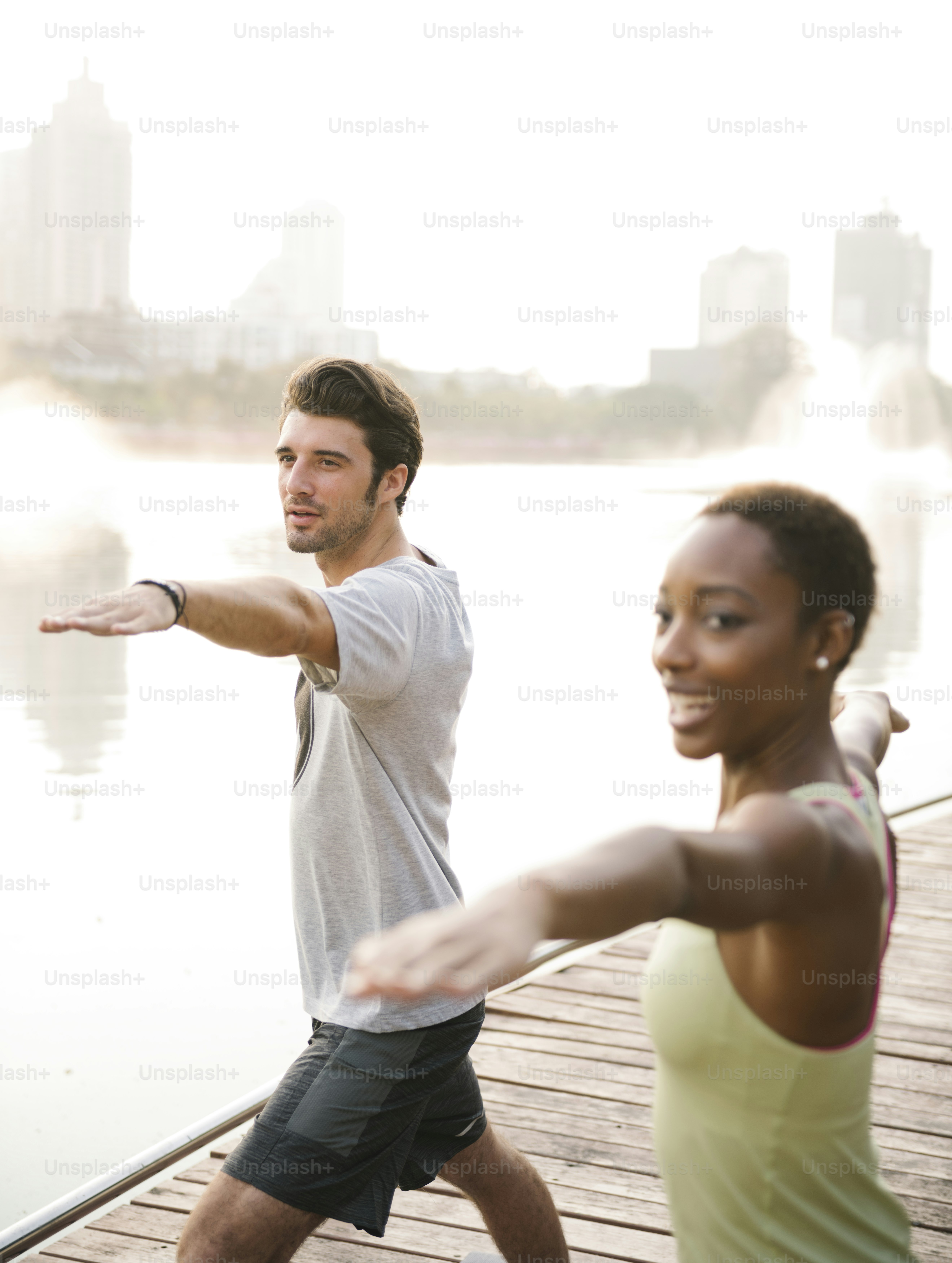 Couple doing a yoga in a park