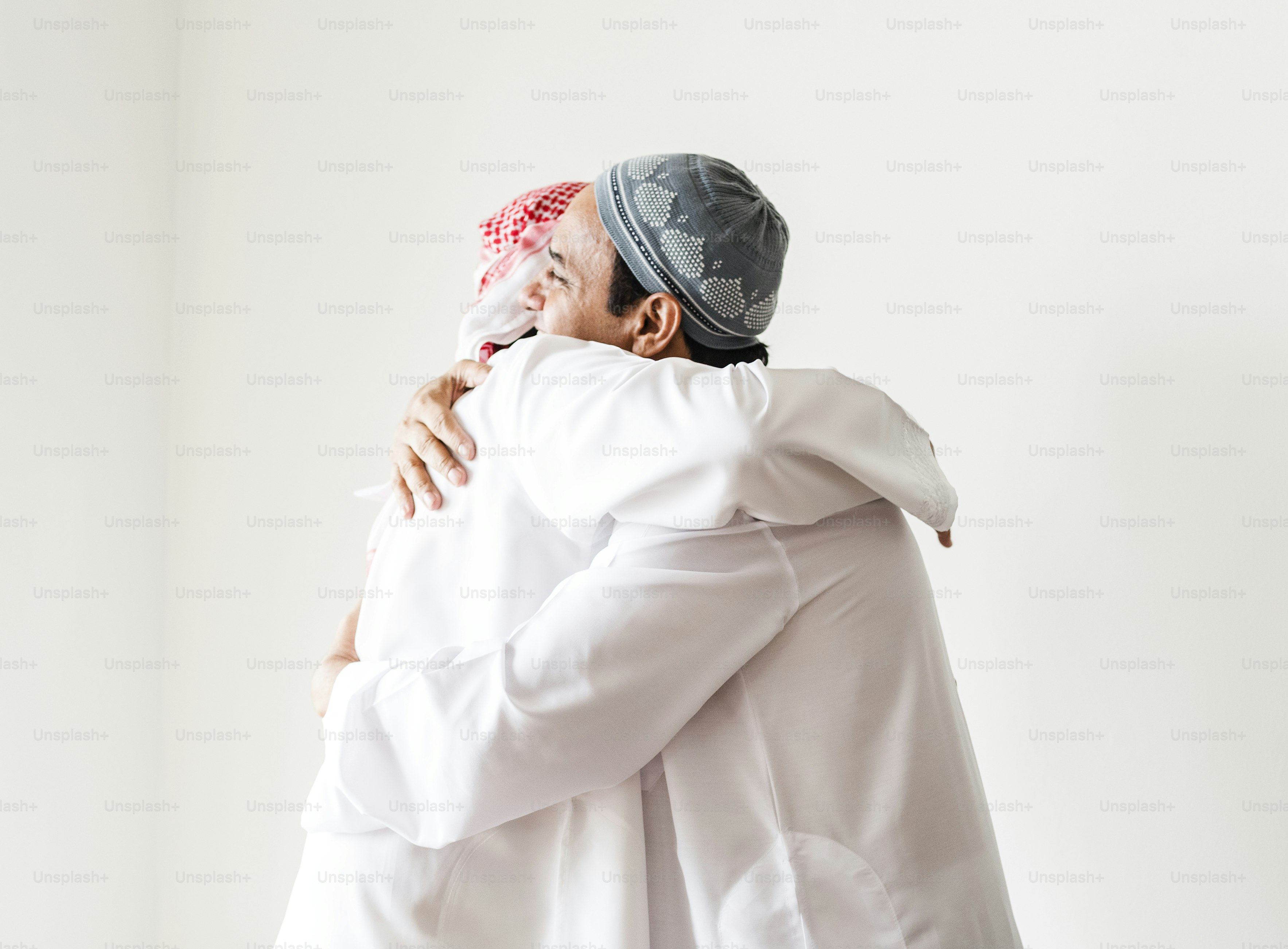 Muslim men hugging each other