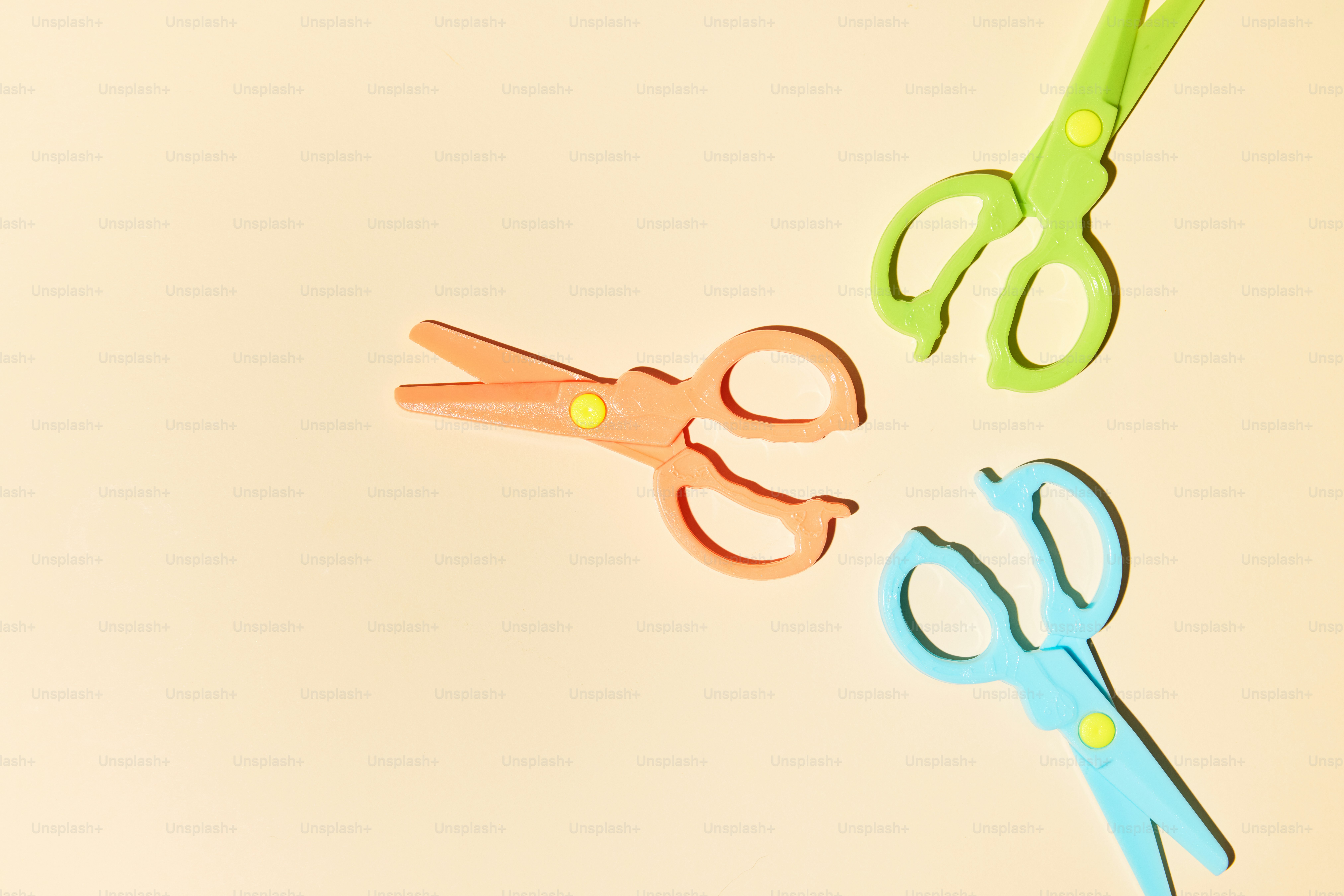 A pair of scissors and a pair of scissors on a table