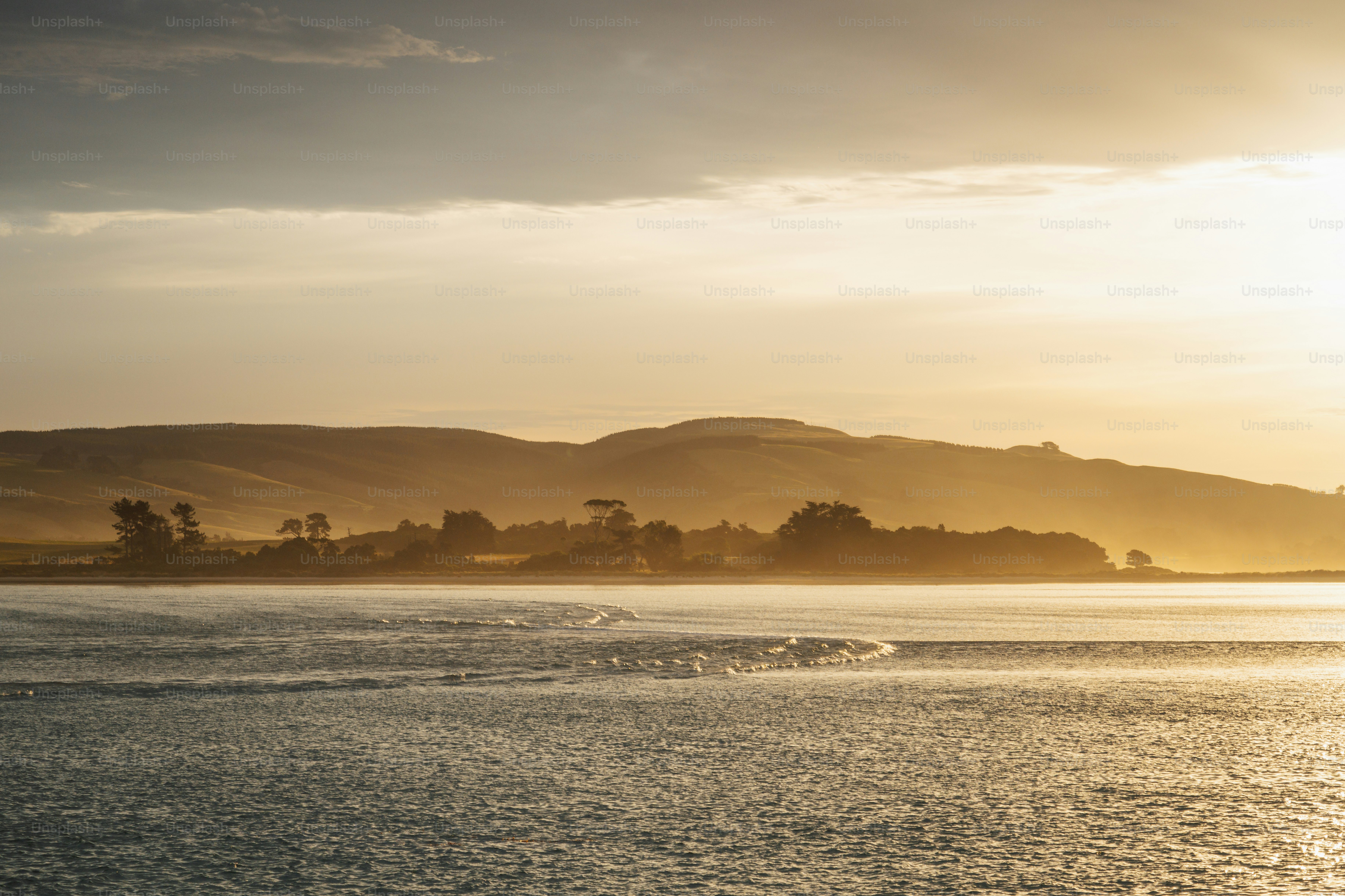 The sun is setting over a body of water