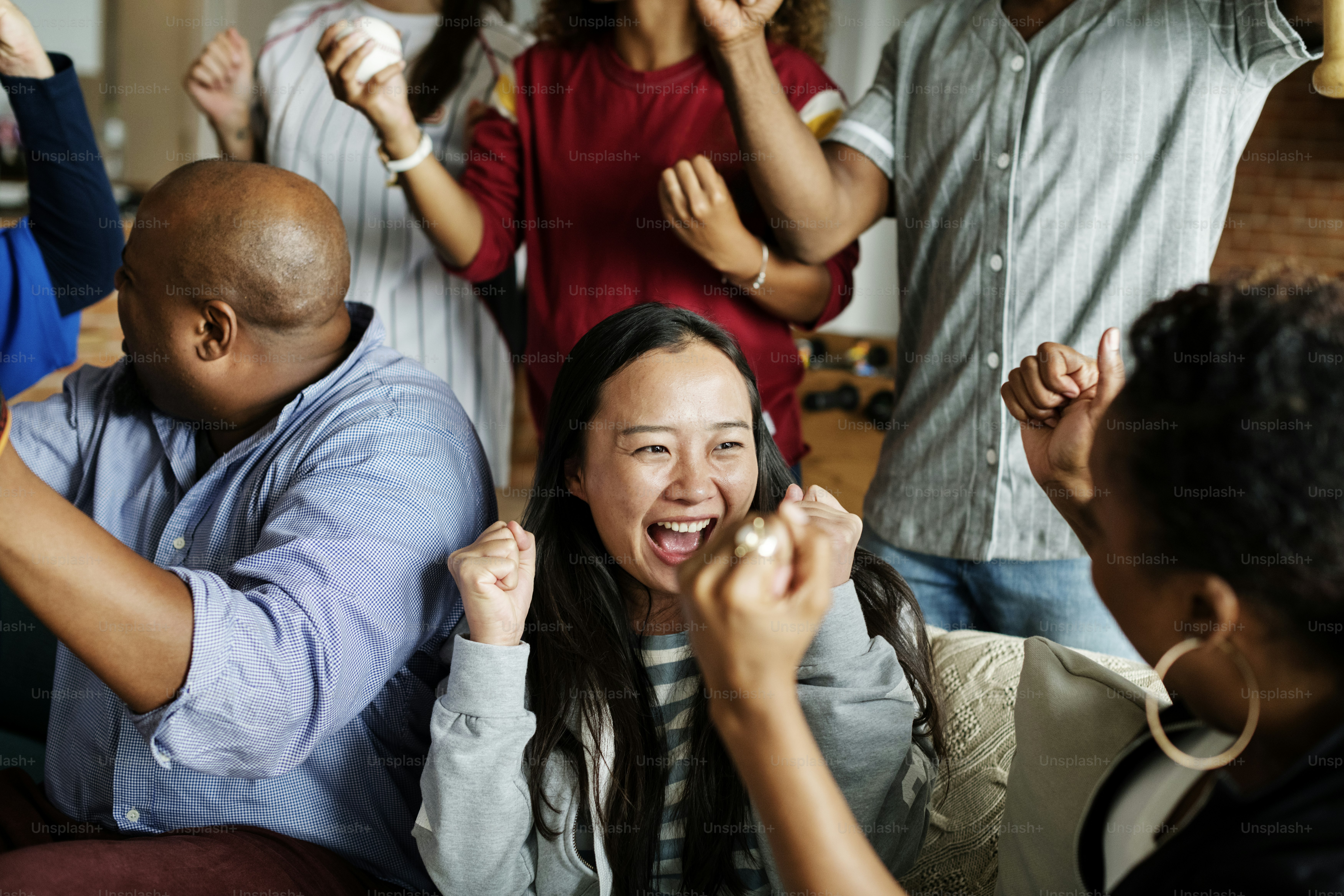 Friends cheering sport league together
