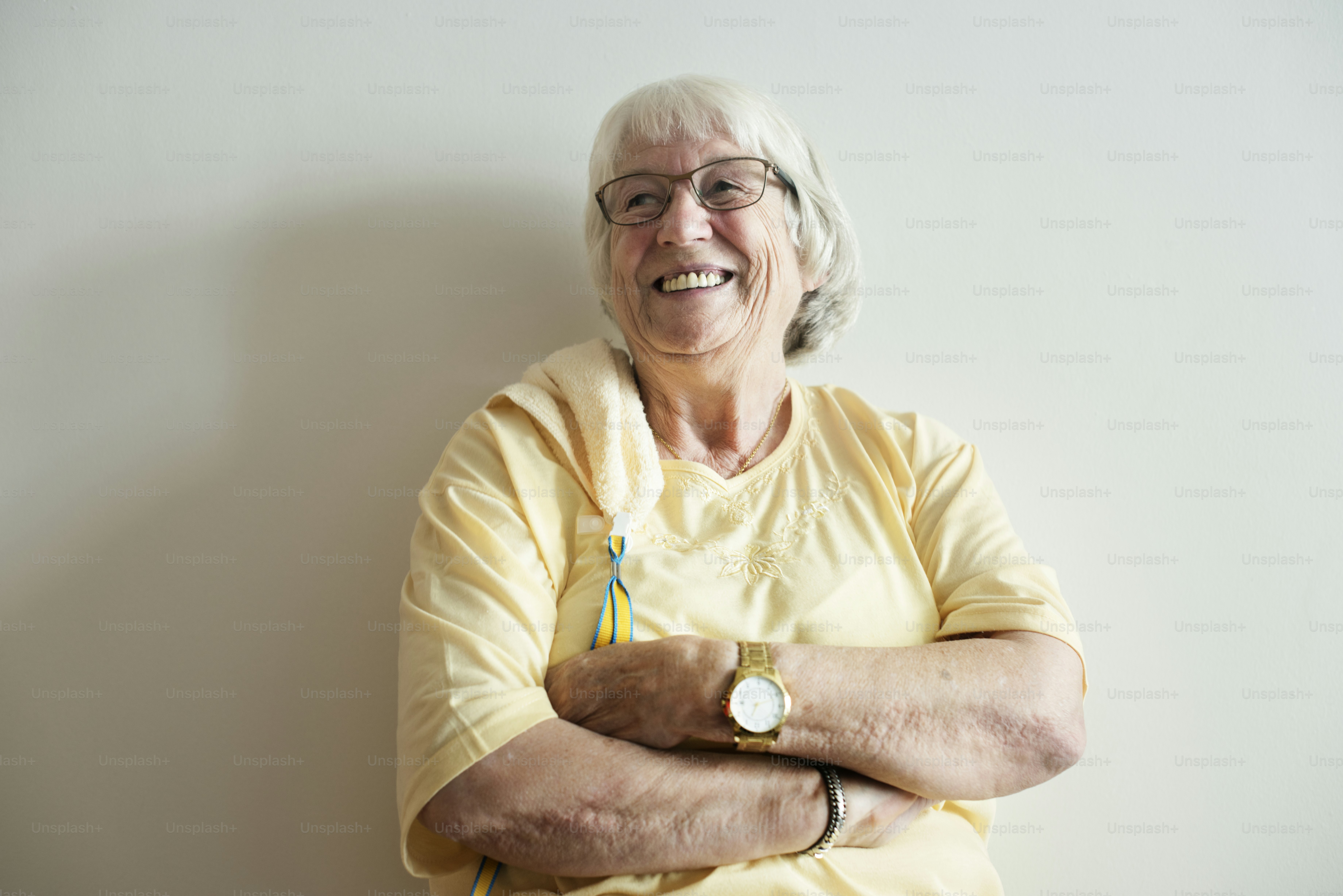 Senior woman arms crossed and smiling