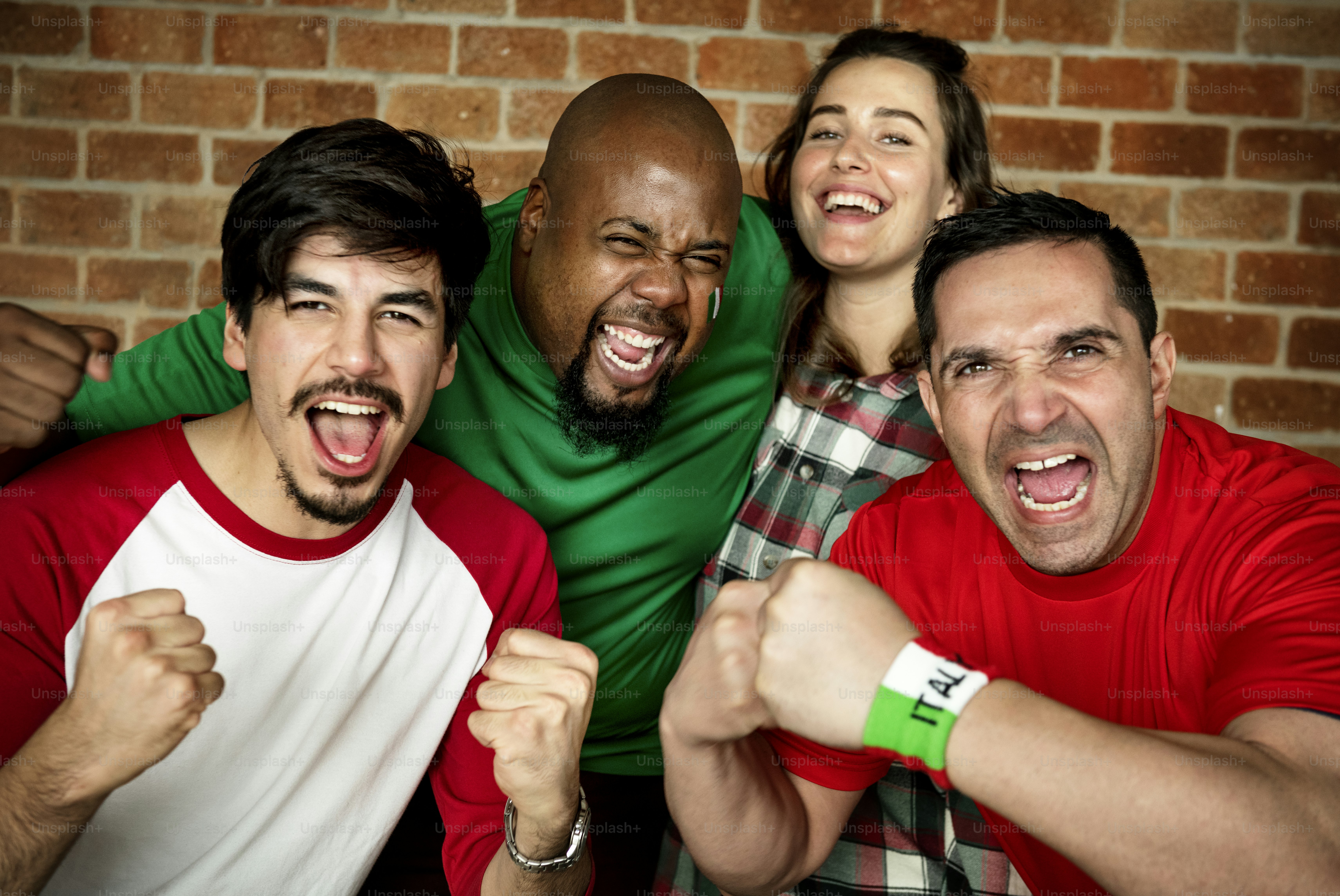 Friends cheering world cup with painted flag