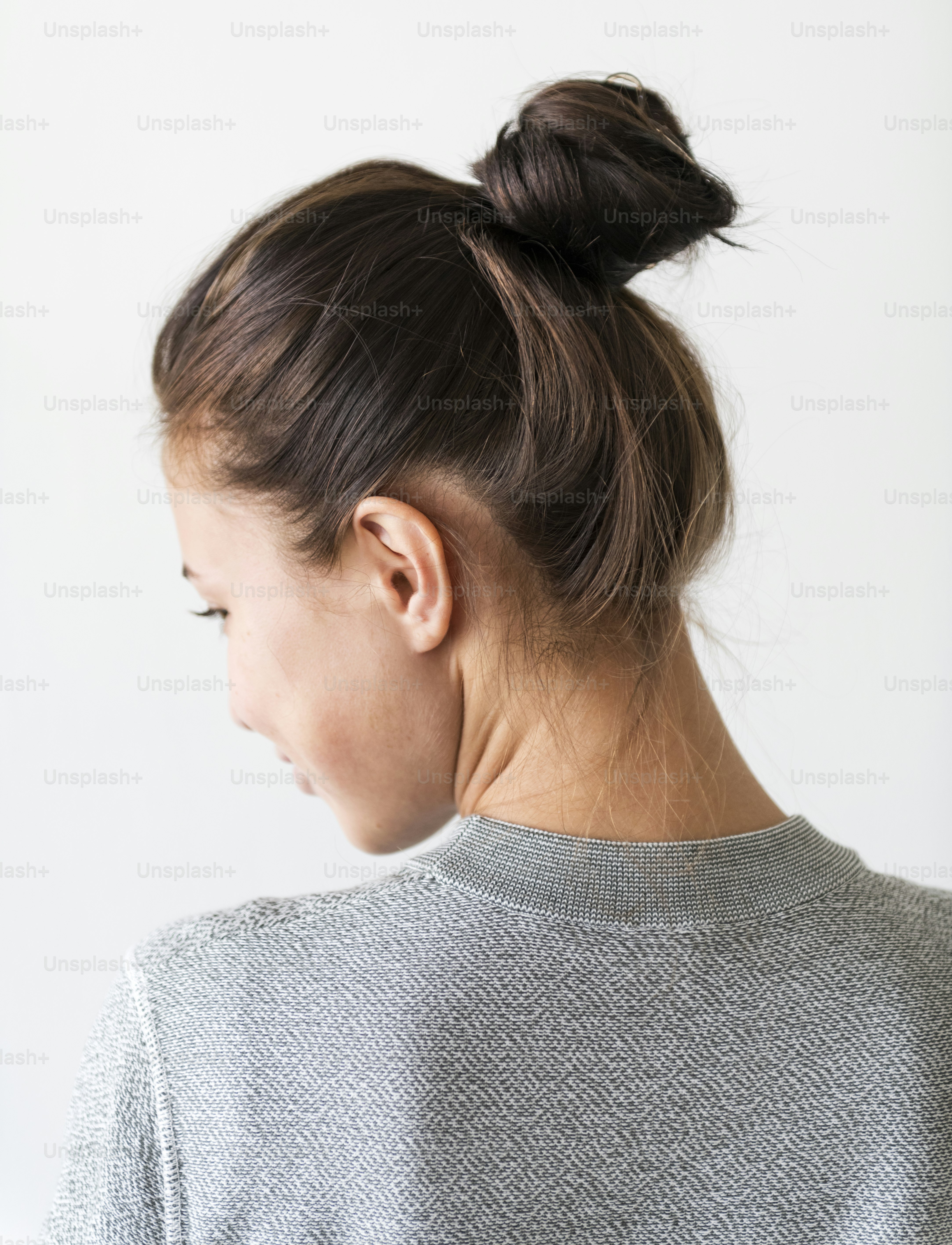 Woman making hair bun