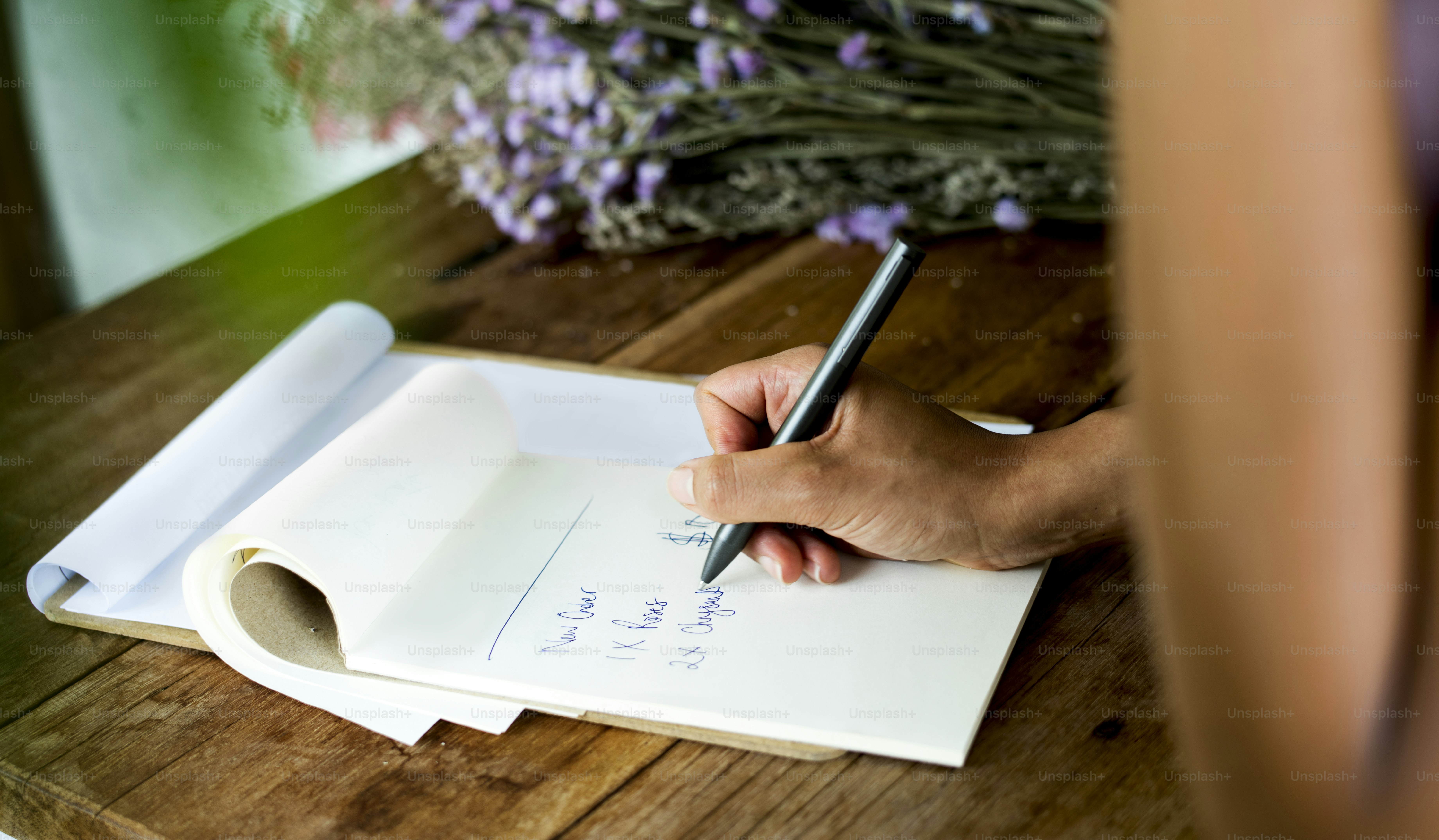 Closeup of hand taking note