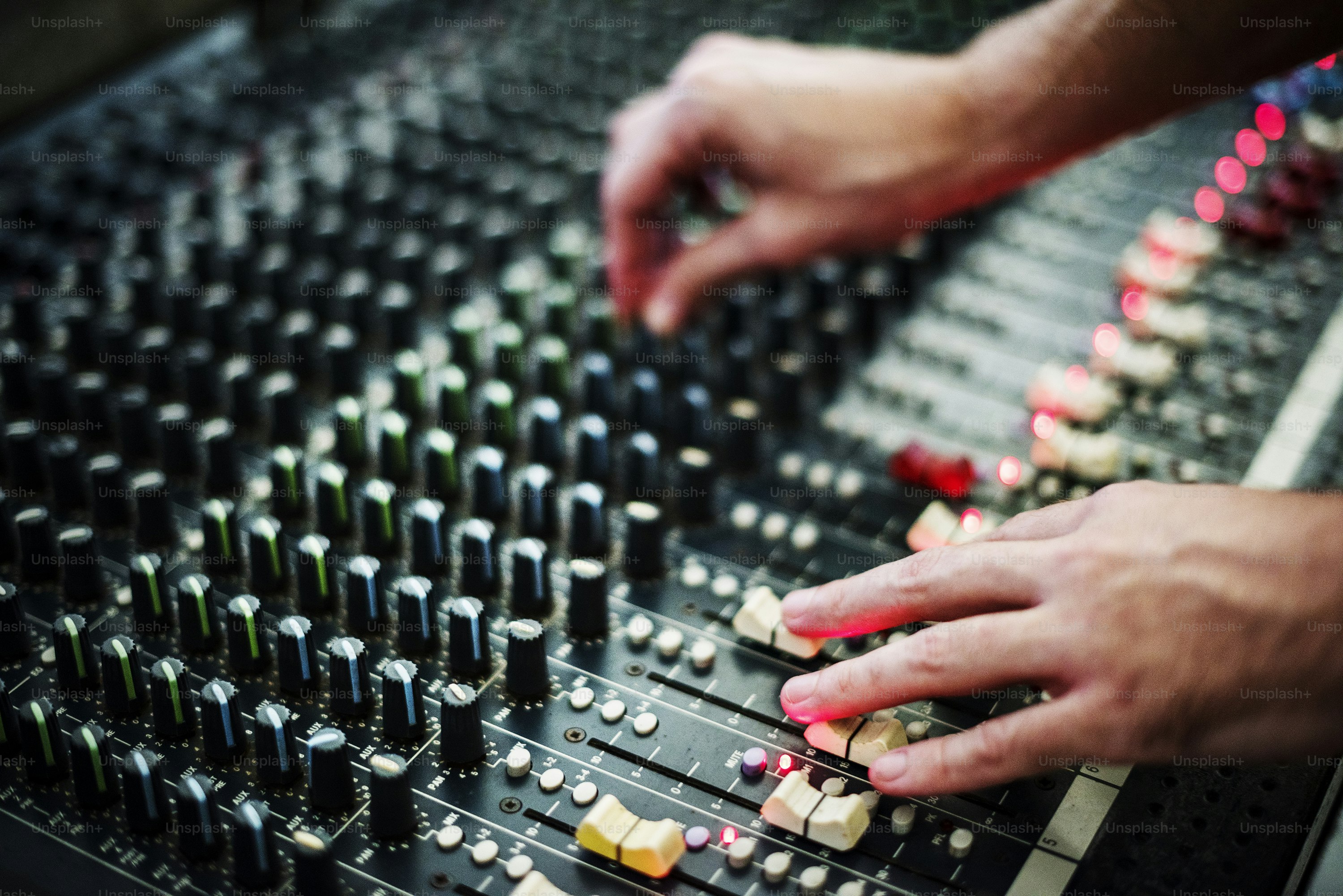 Hand on a sound mixer station