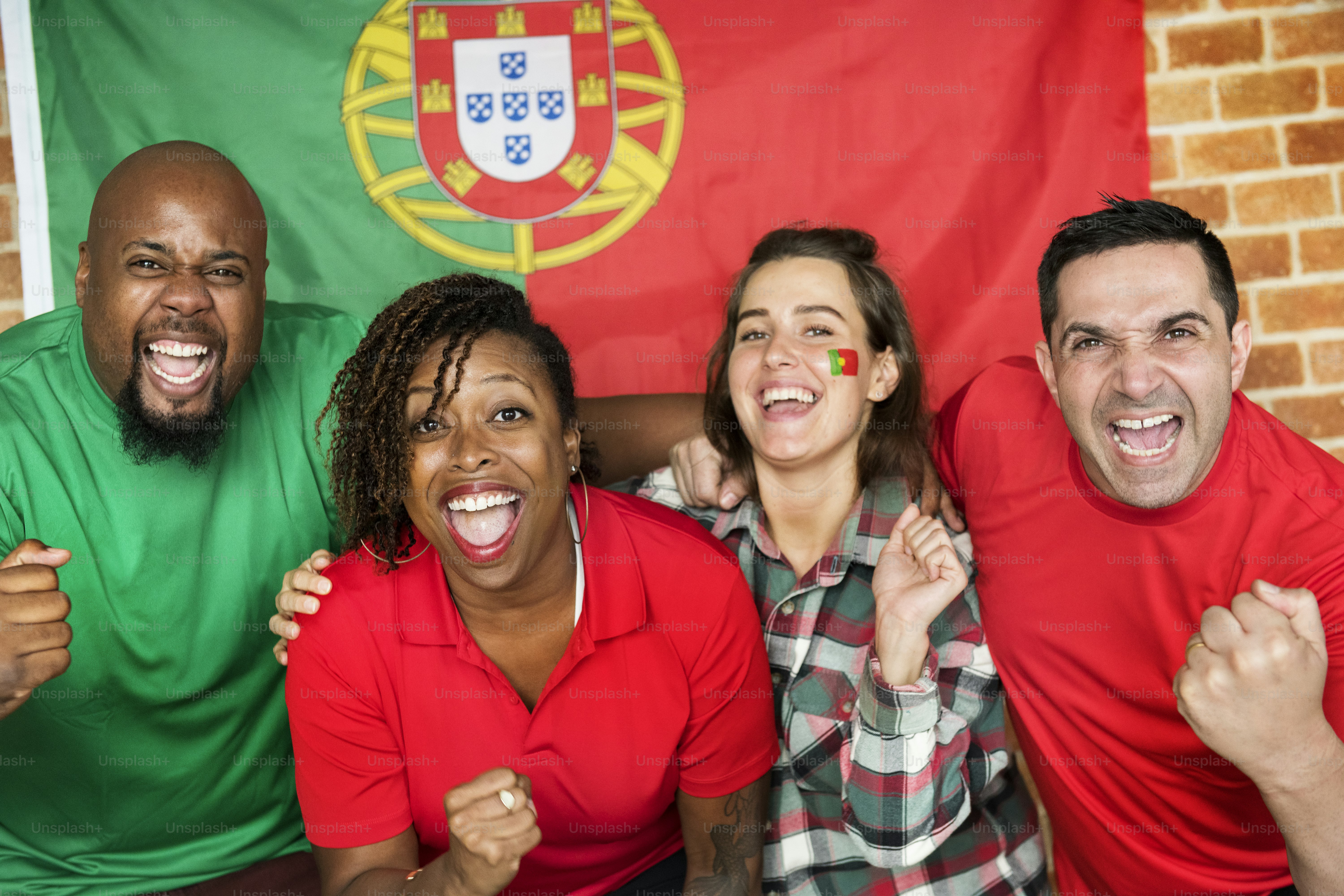Friends cheering world cup with painted flag