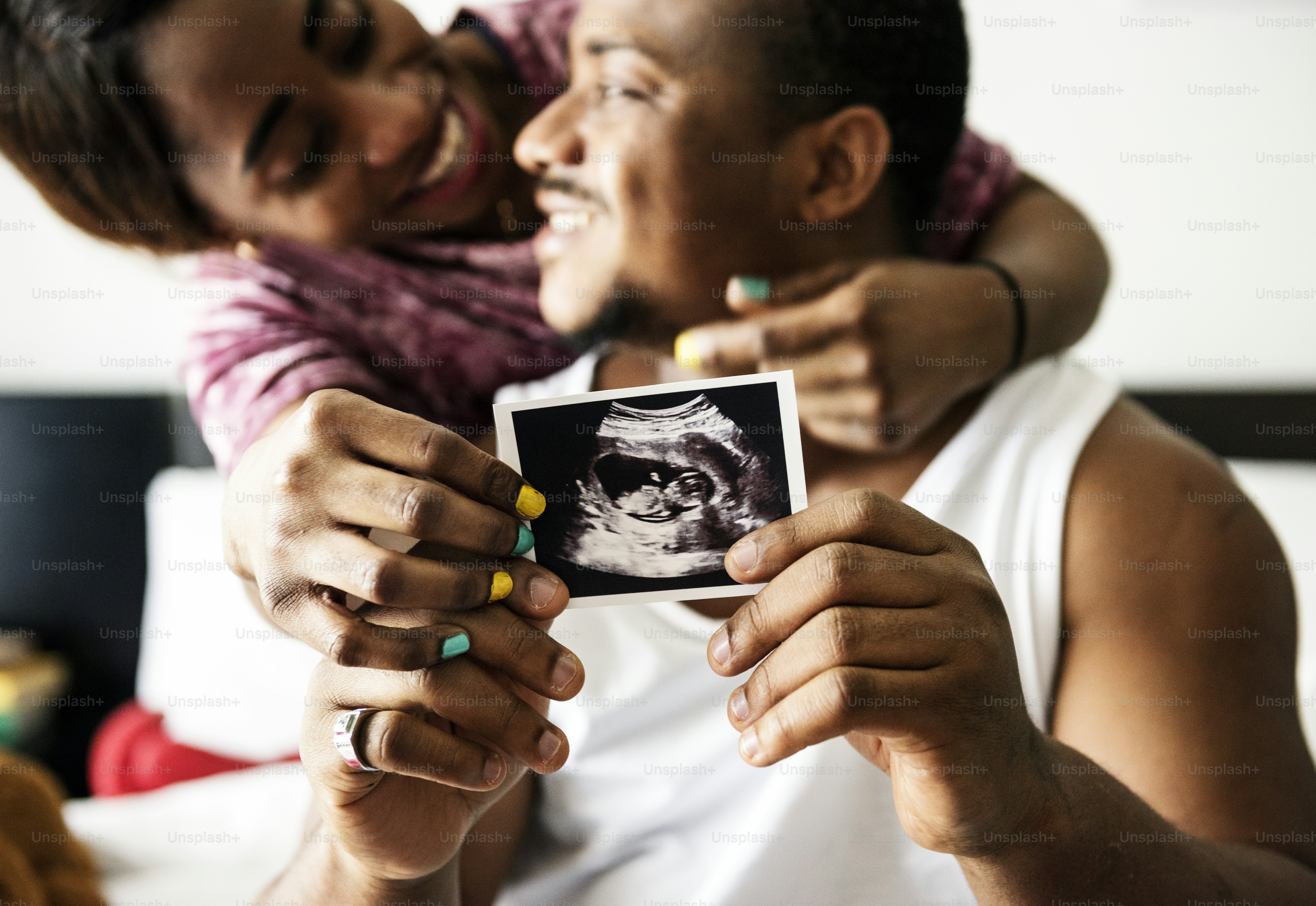 Expectant parents watching 3D baby images in an elective ultrasound studio