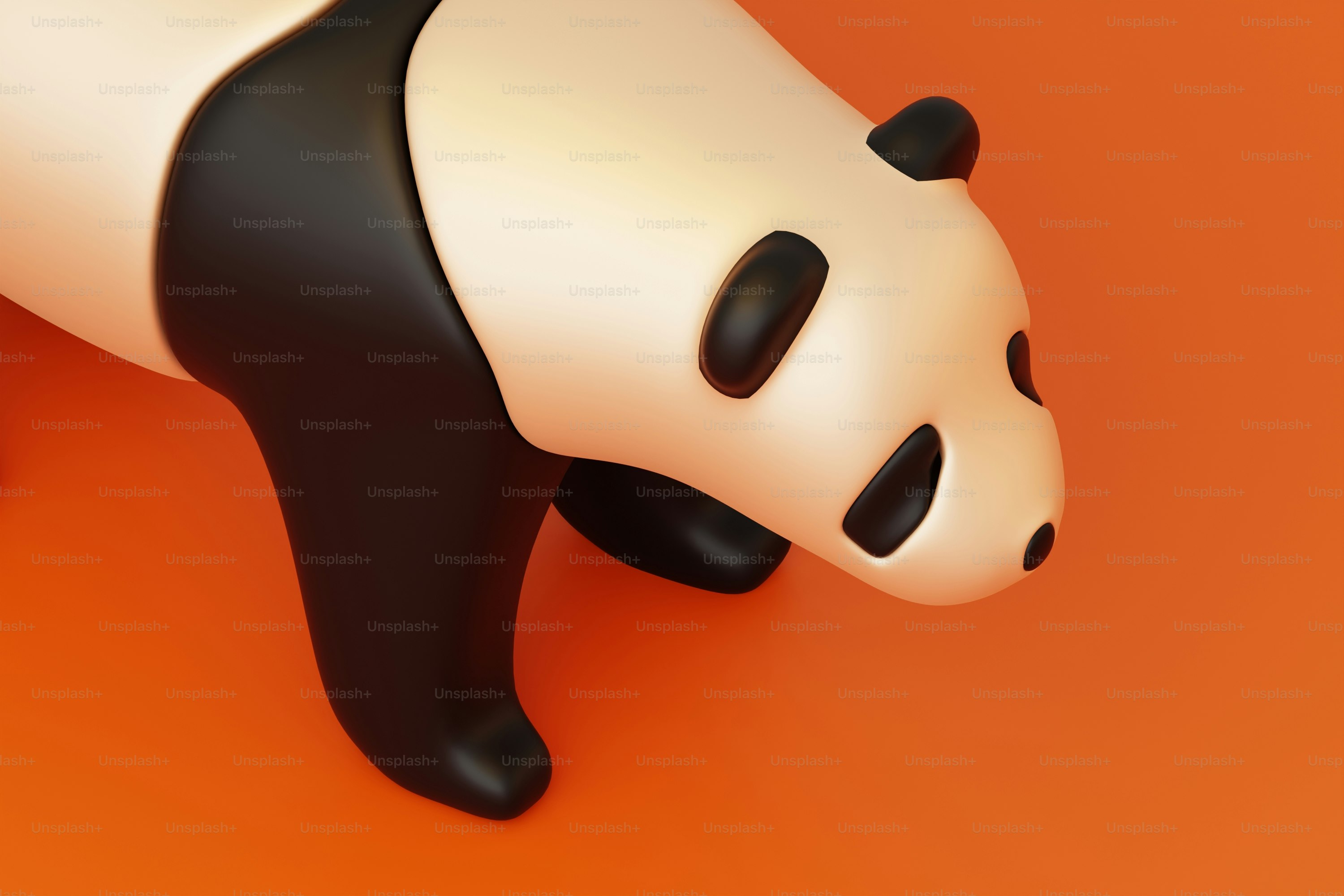 A black and white panda bear on an orange background