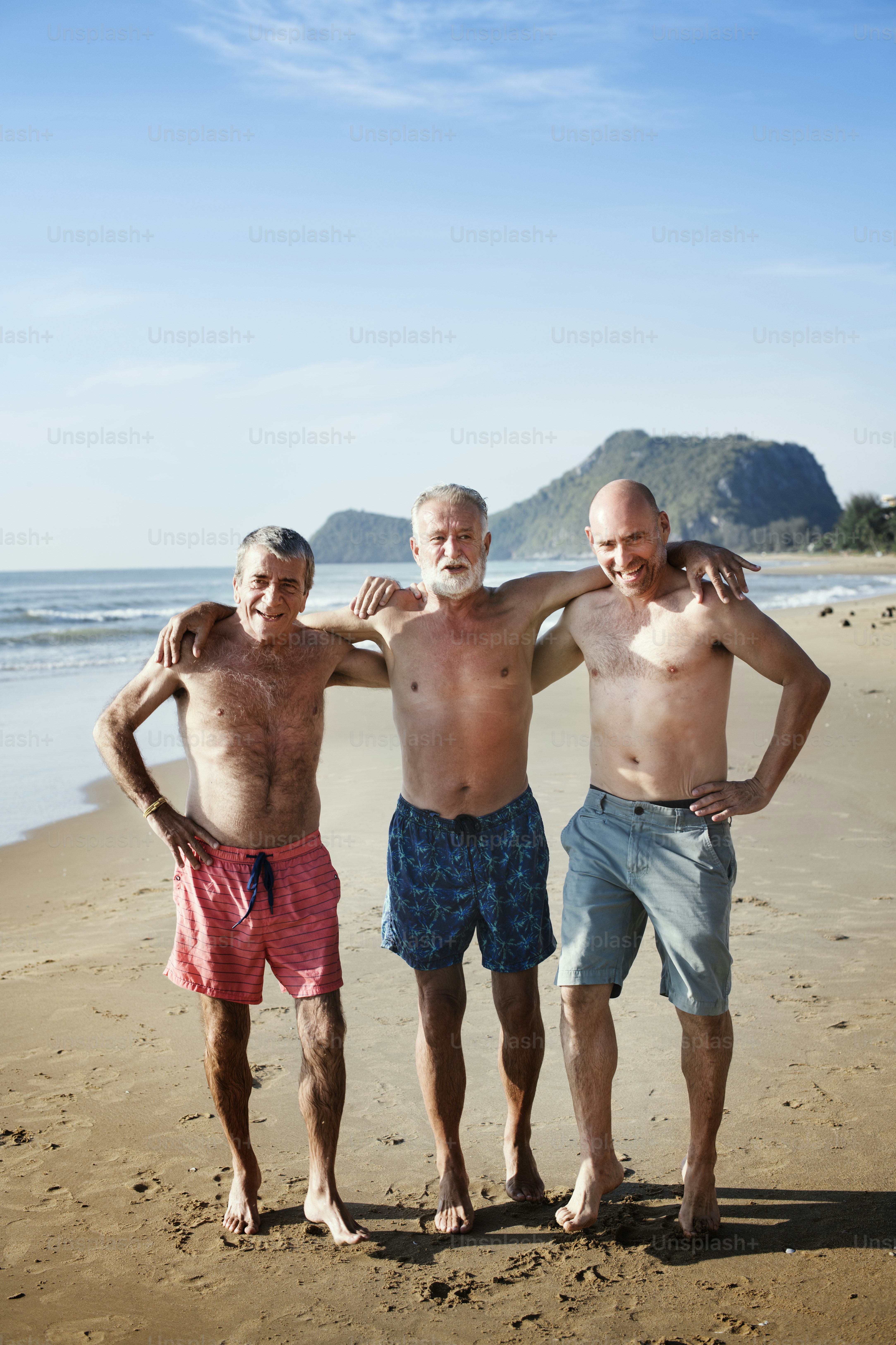 Senior friends enjoying the beach in the summertime