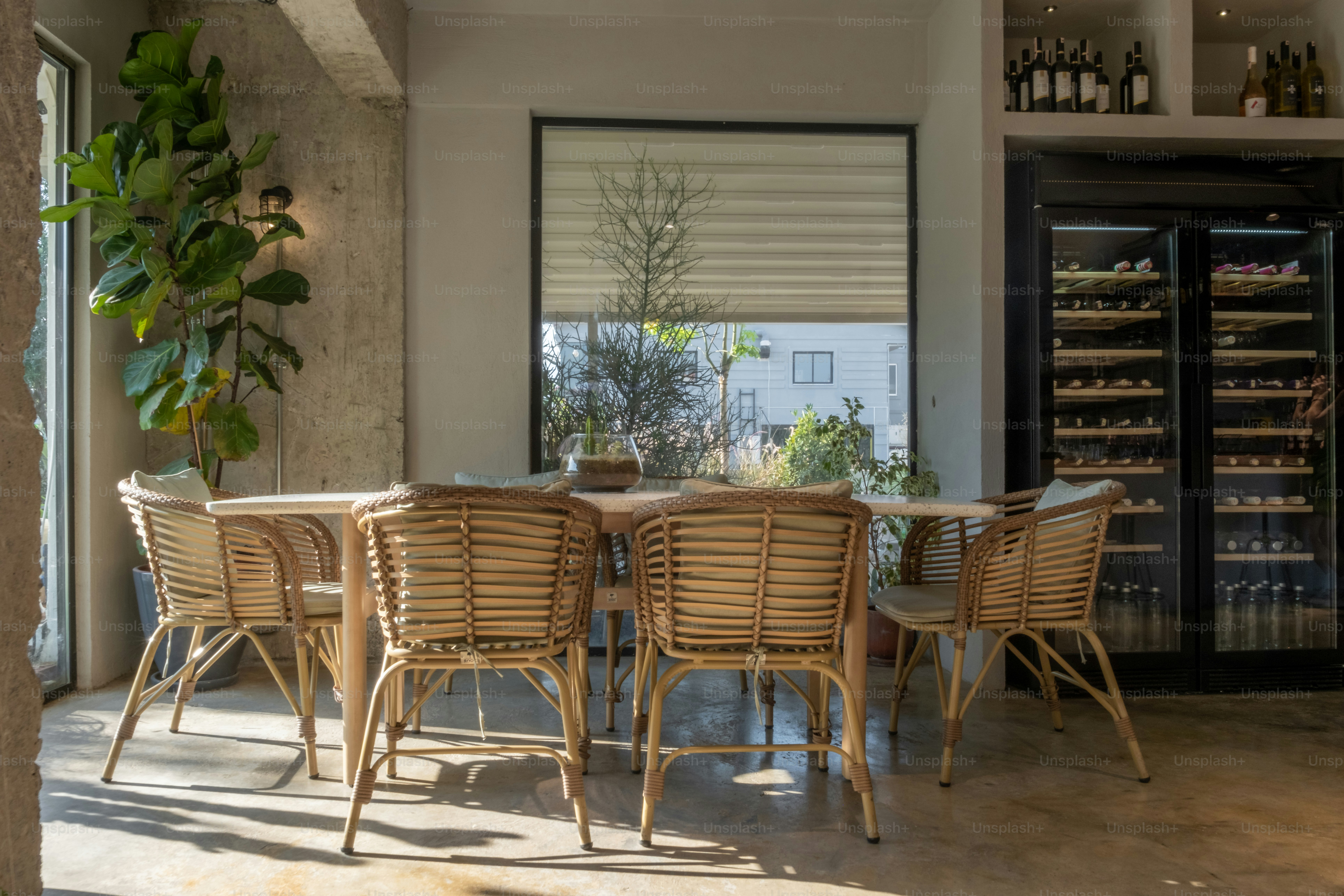 A dining room with a table and chairs