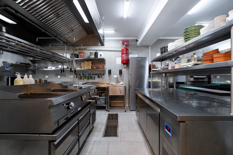 Commercial kitchen renovation with stainless steel equipment
