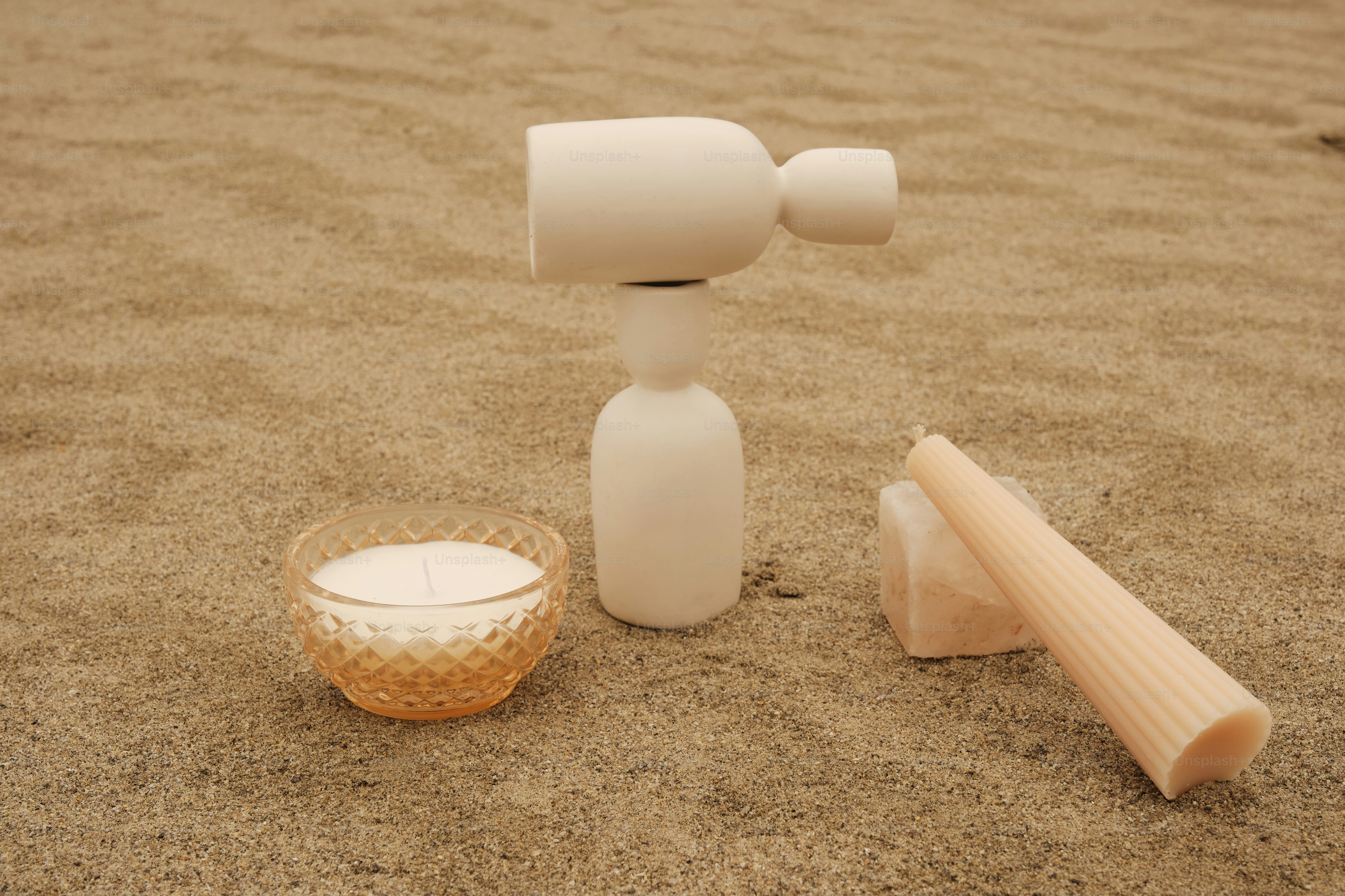 A plastic object sitting on top of a sandy beach