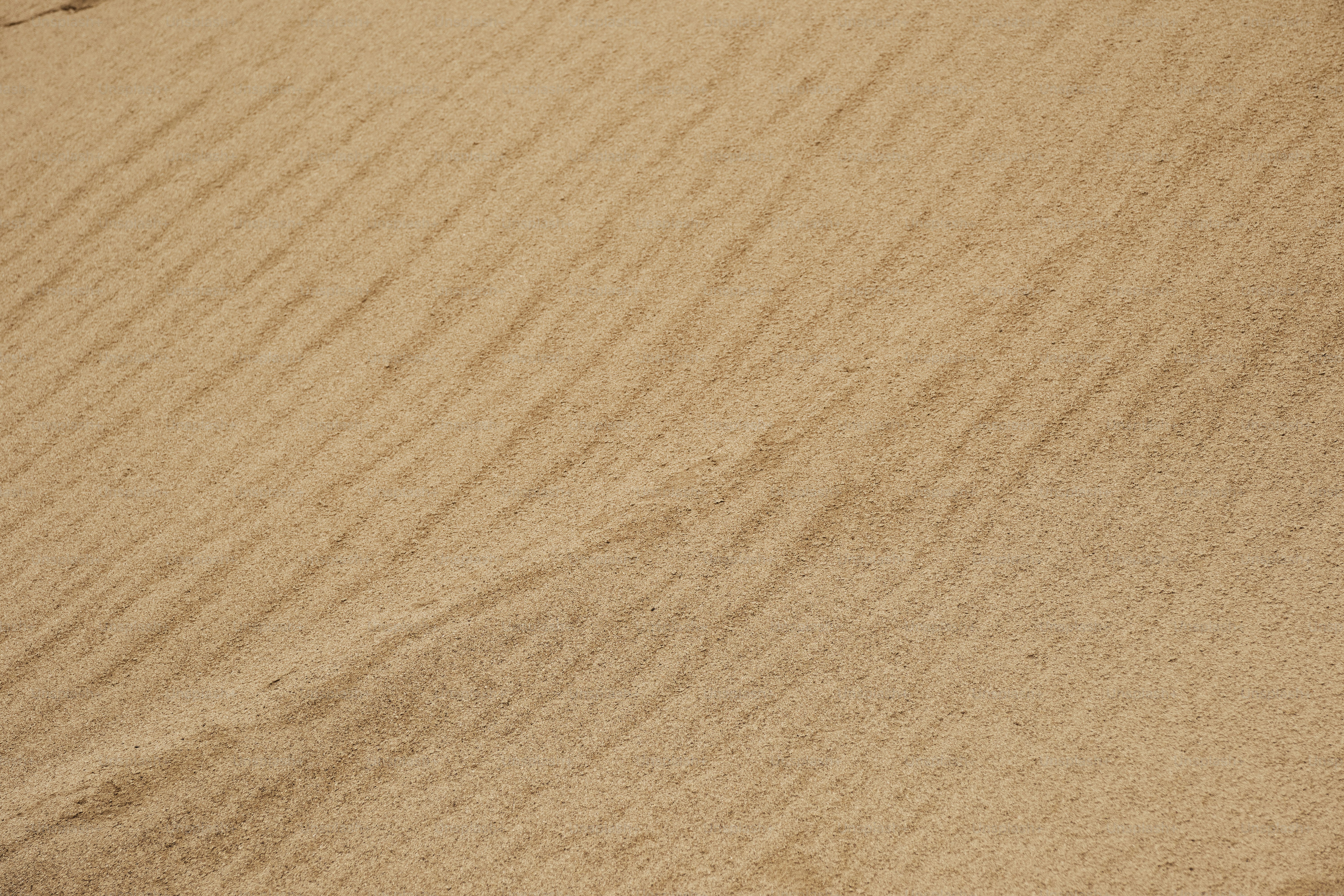 A man riding a snowboard down a snow covered slope