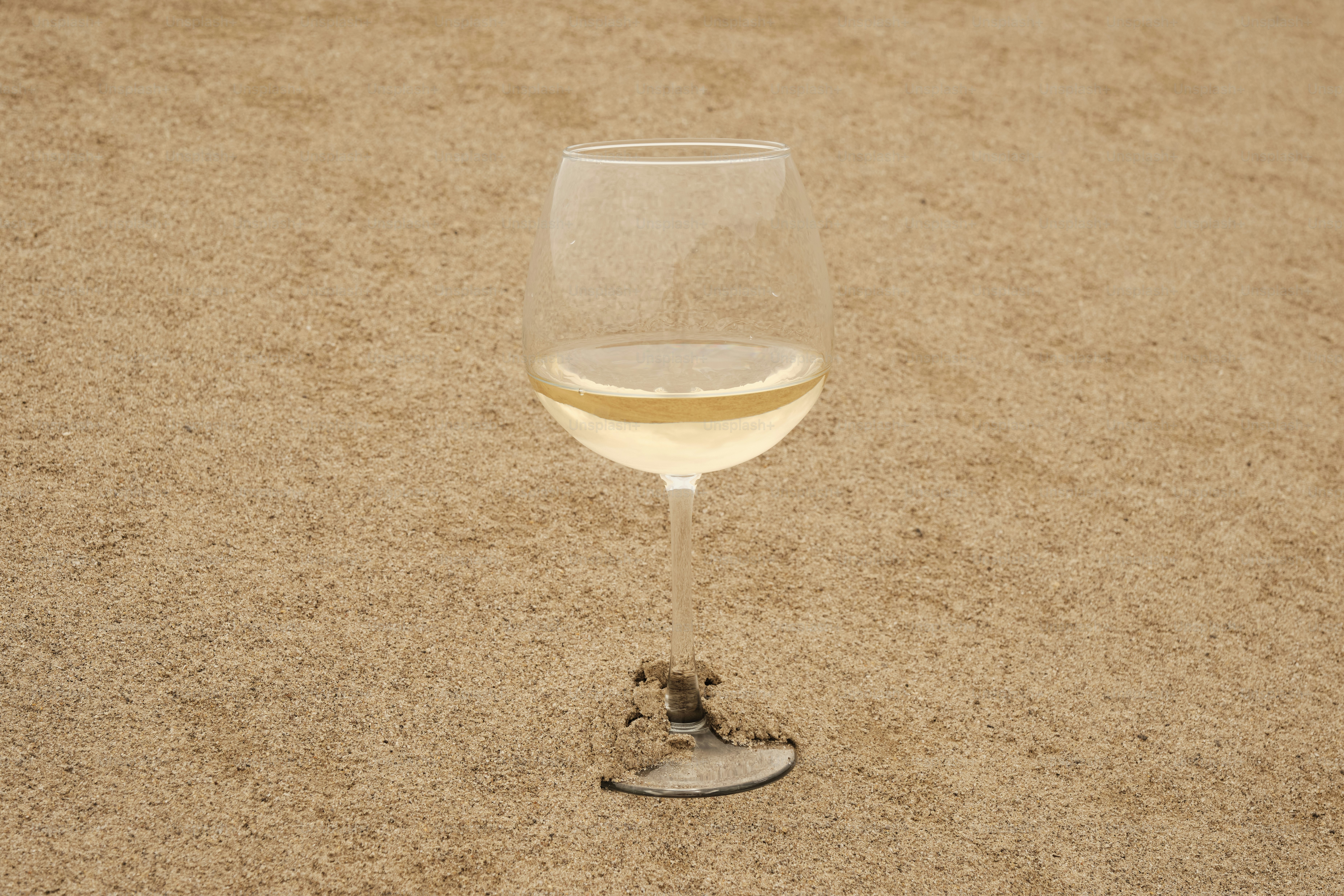 wine glass on the sand