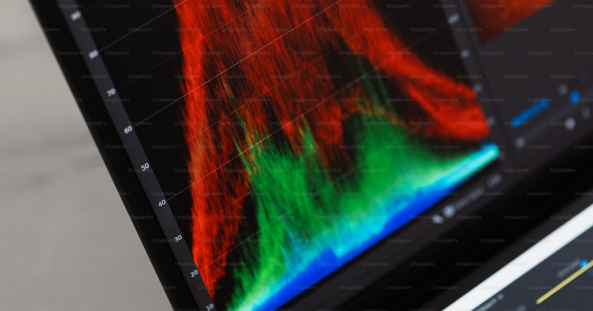 A close up of a computer screen with sound waves on it photo – Colour ...