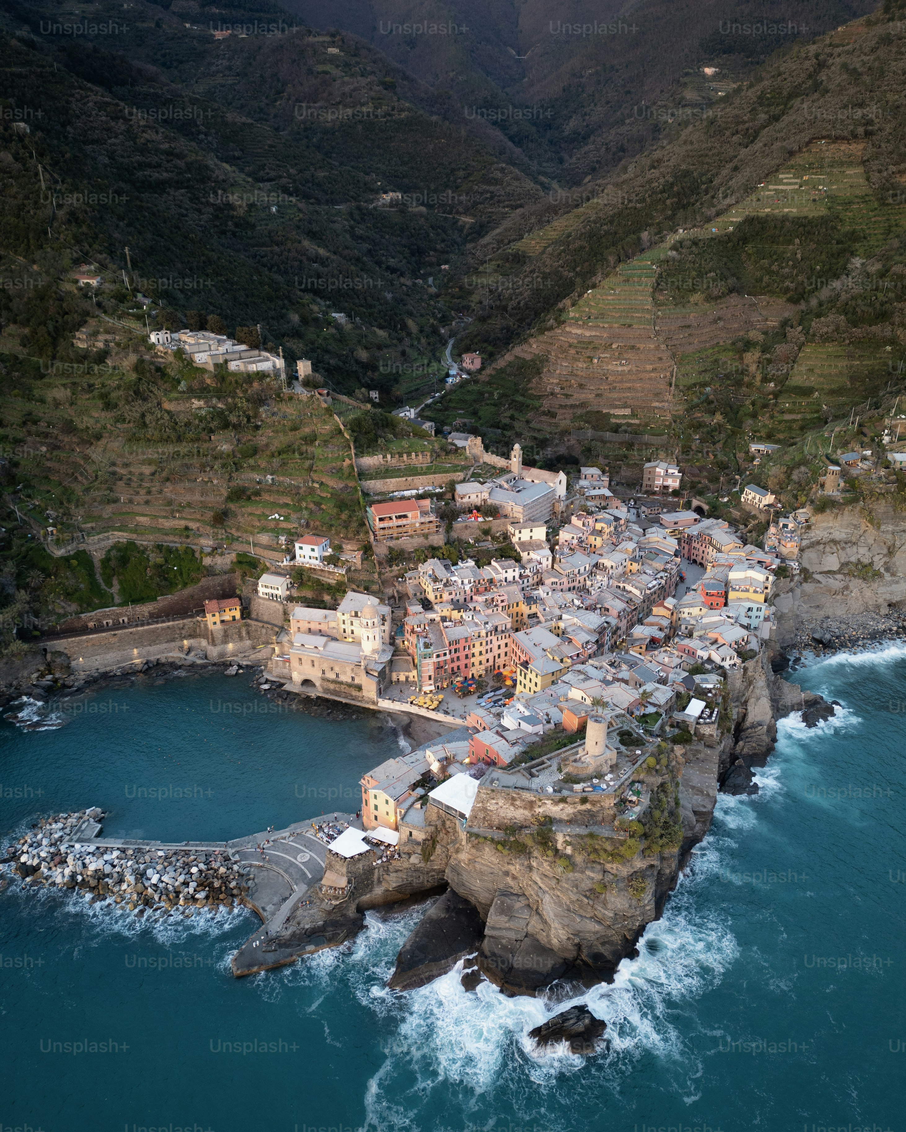 An aerial view of a village on a cliff