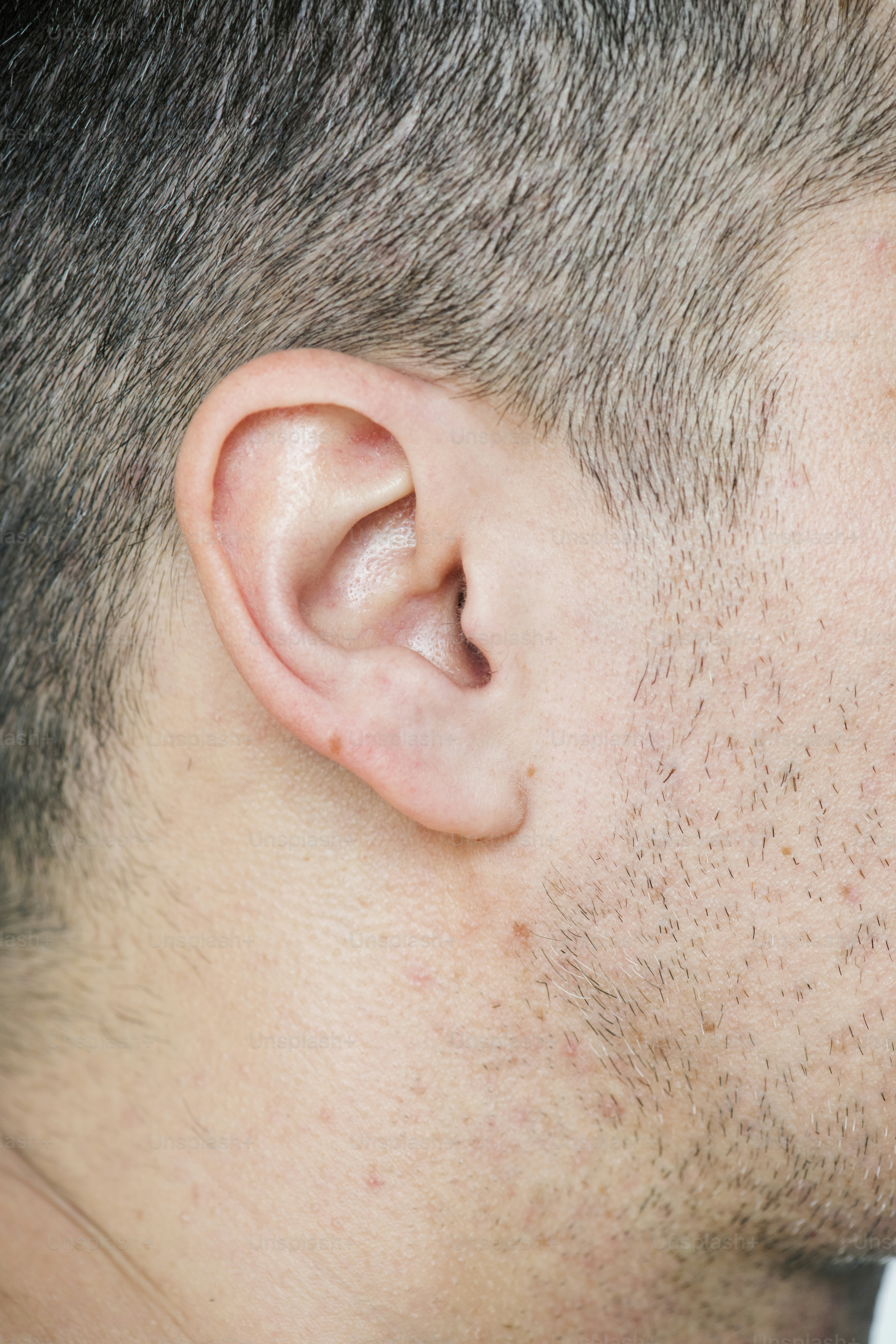 Closeup of white man's ear