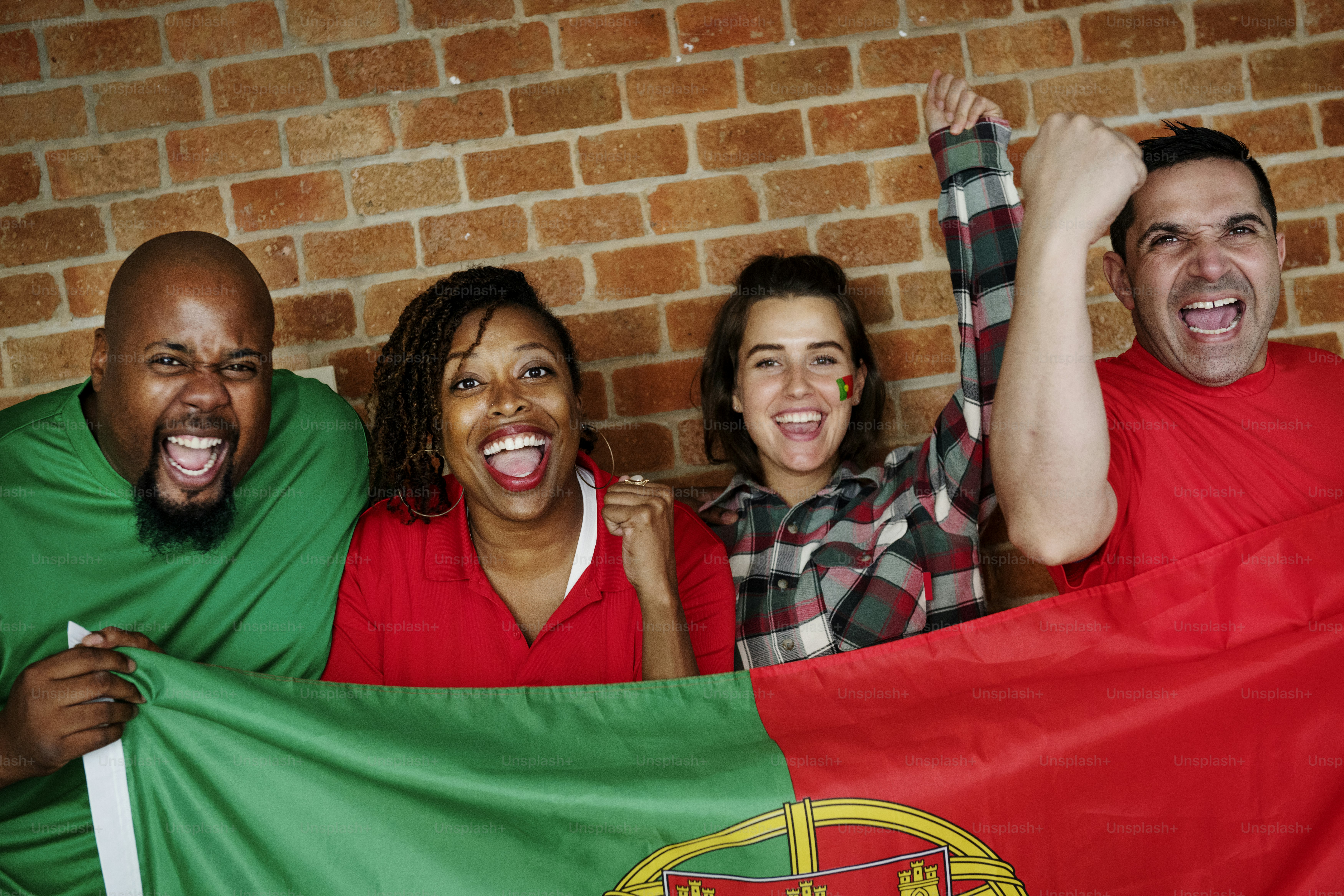 Friends cheering world cup with painted flag