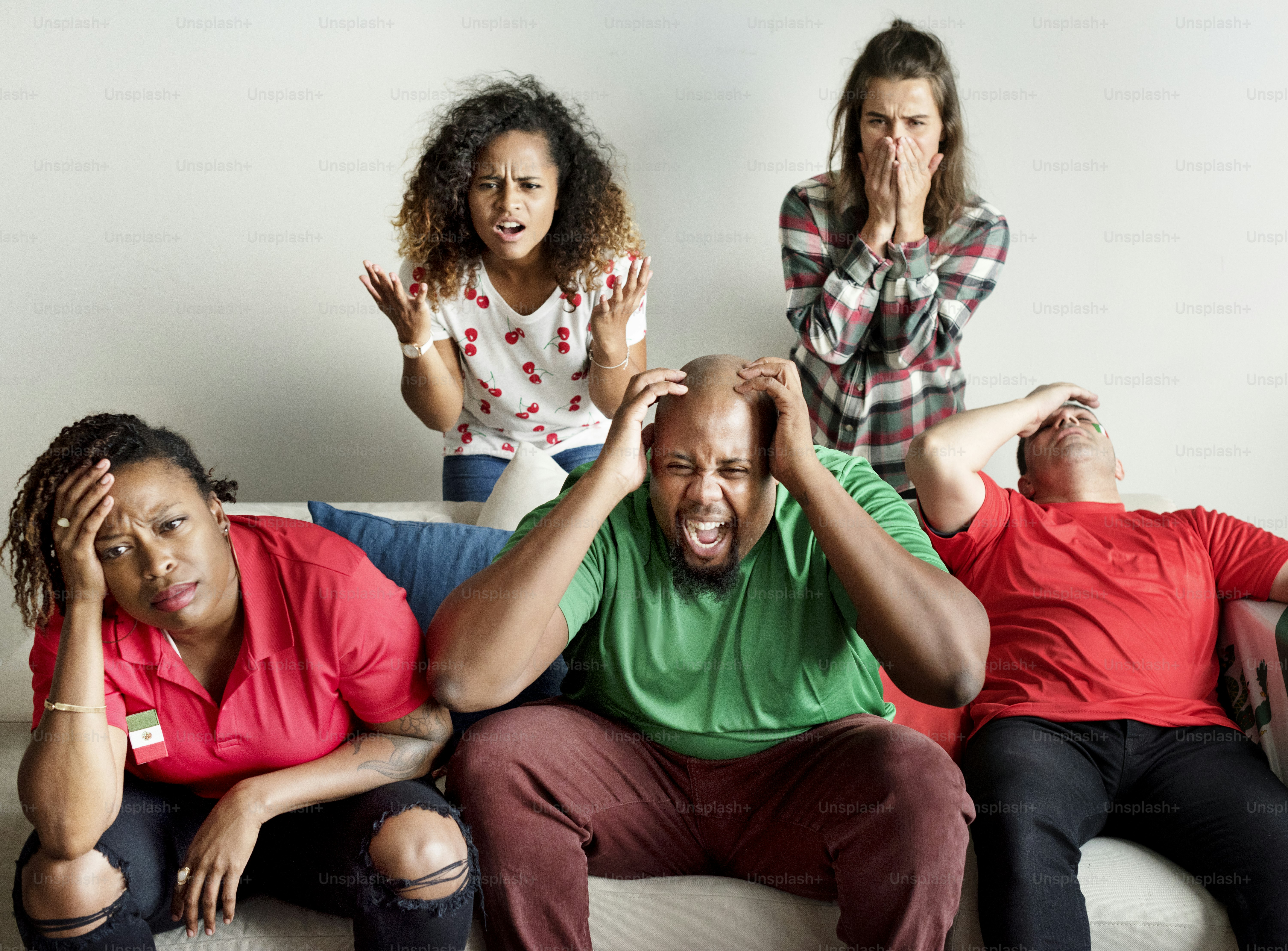 Friends cheering world cup with painted flag