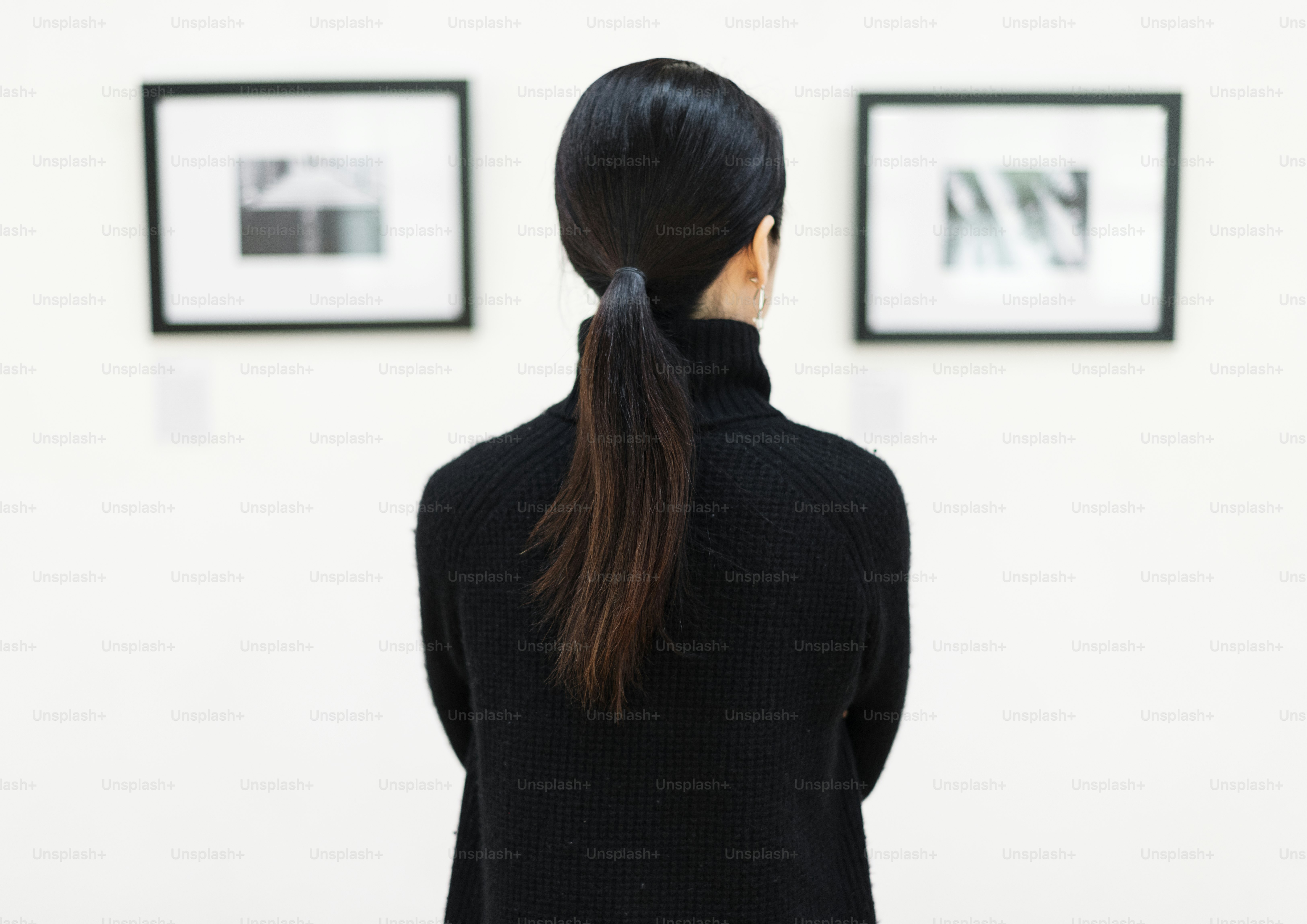 Woman looking at the art exhibition