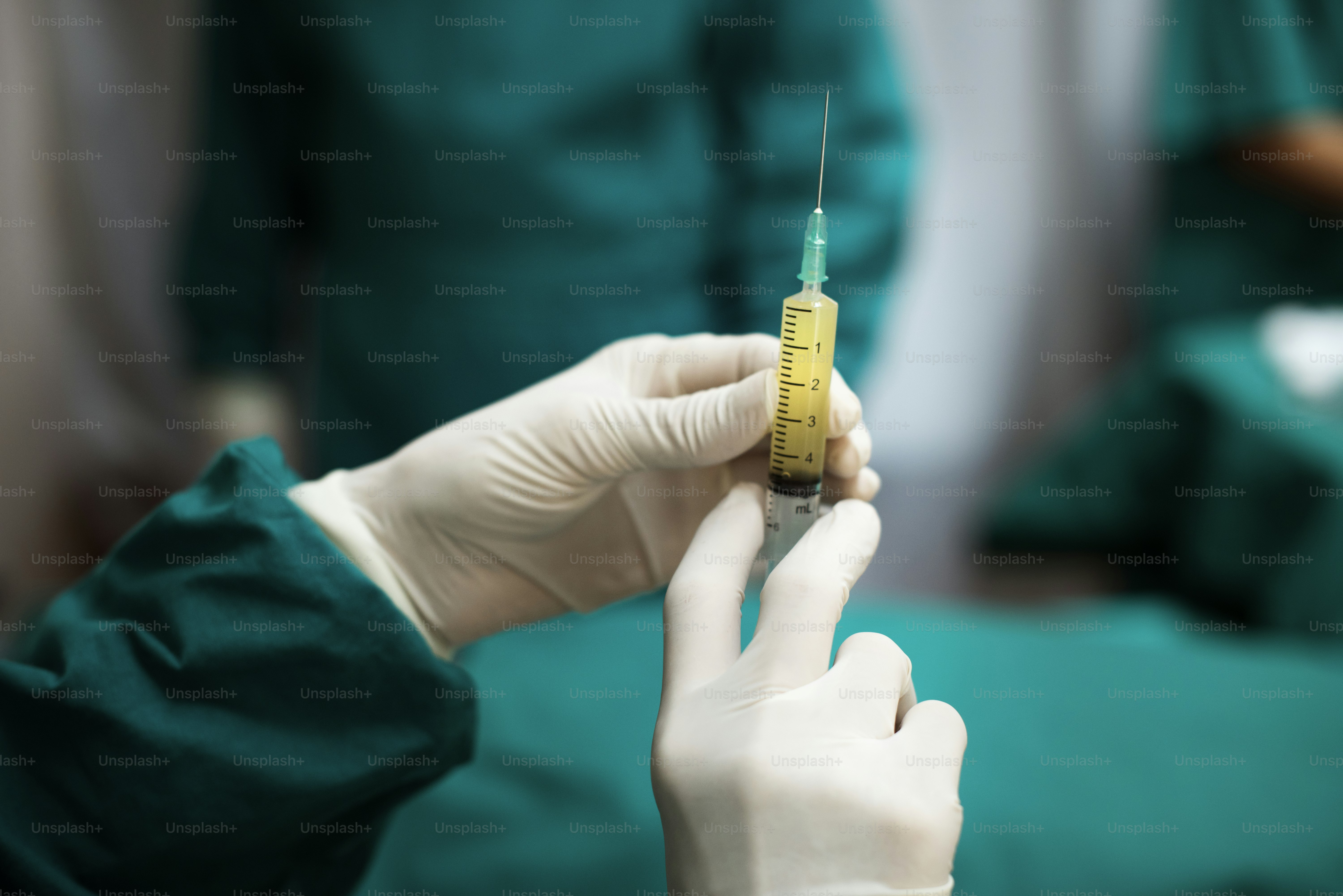 Doctor preparing a syringe shot