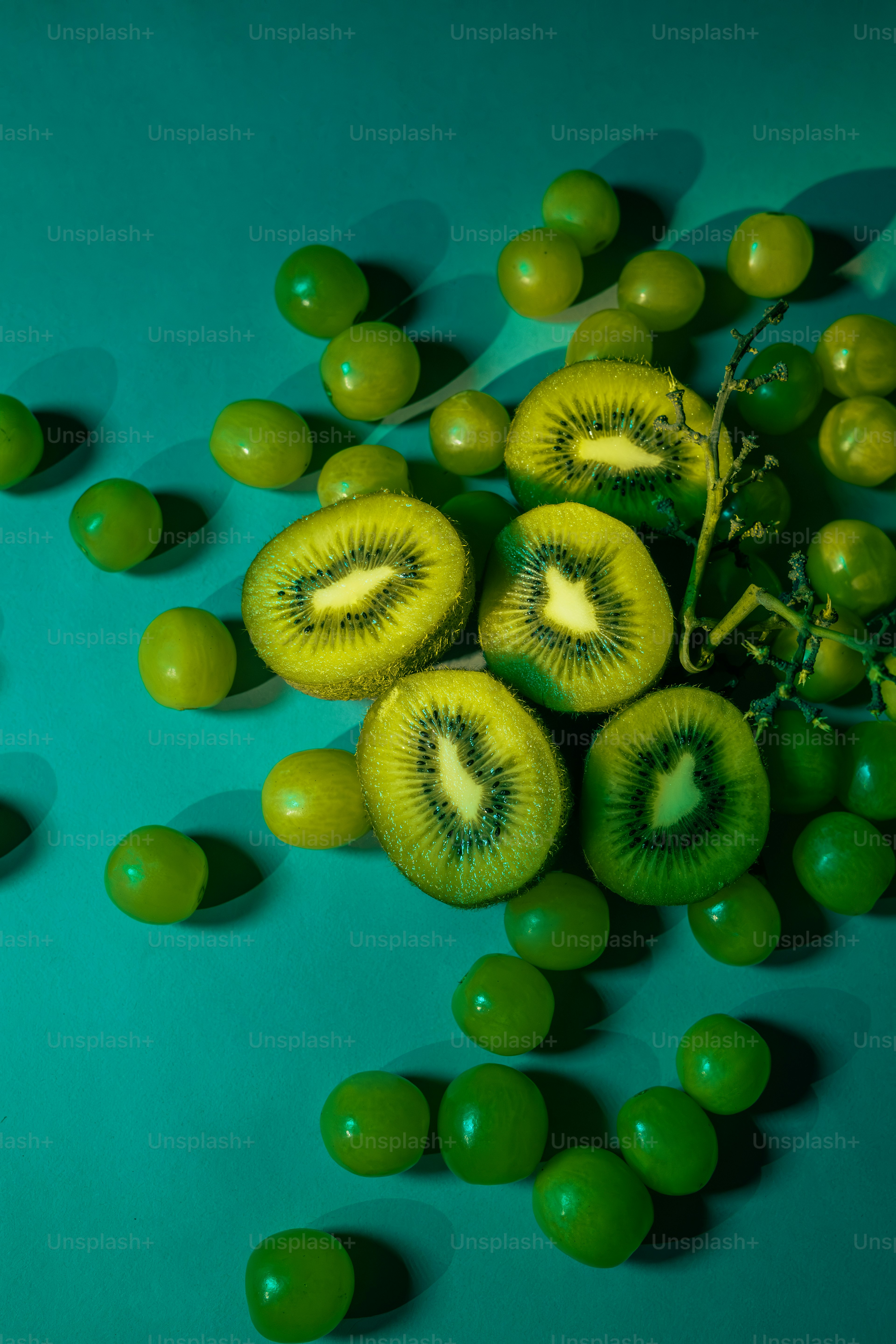 A bunch of kiwis sitting on top of a table