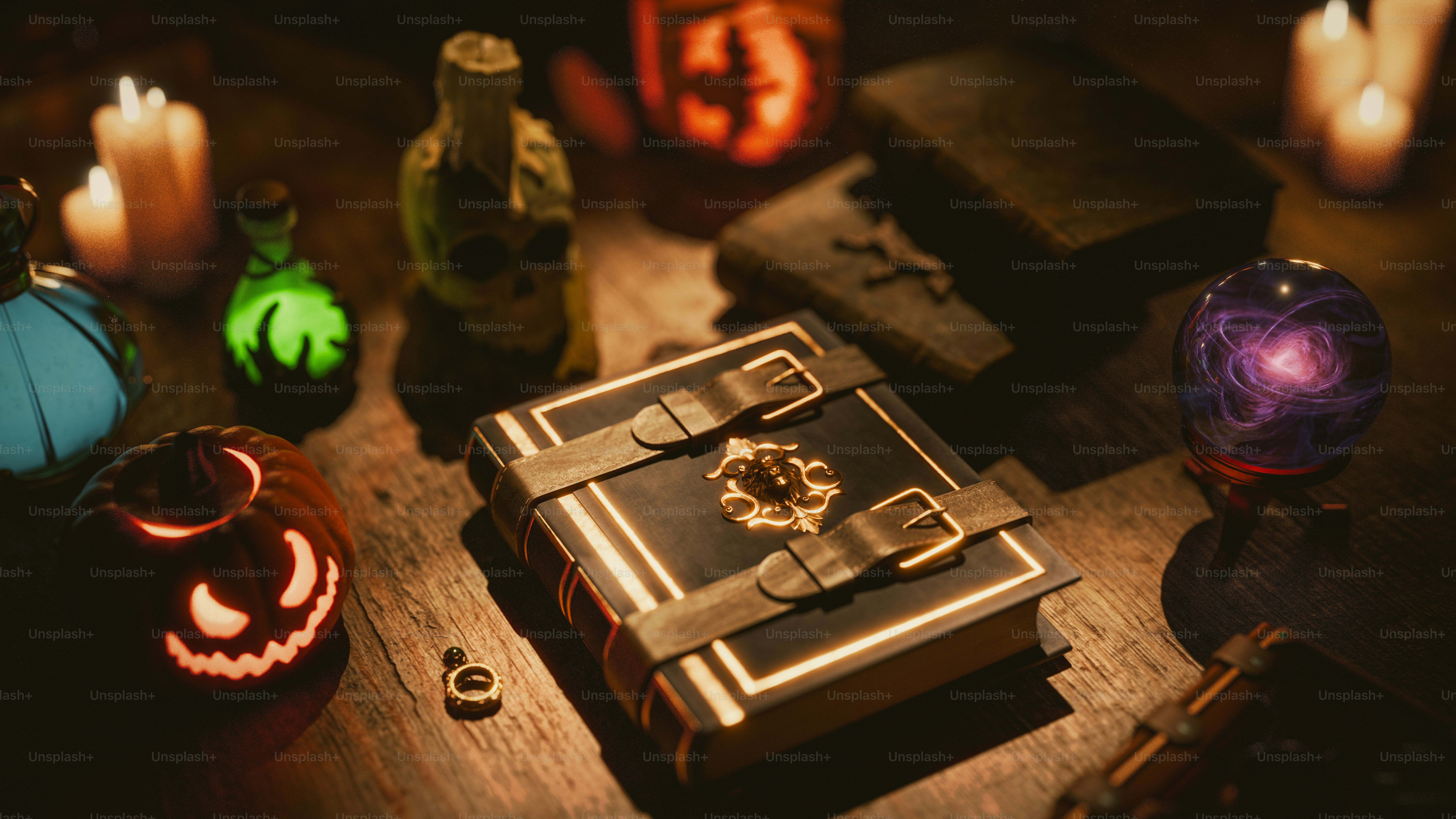 A wooden table topped with lots of halloween decorations