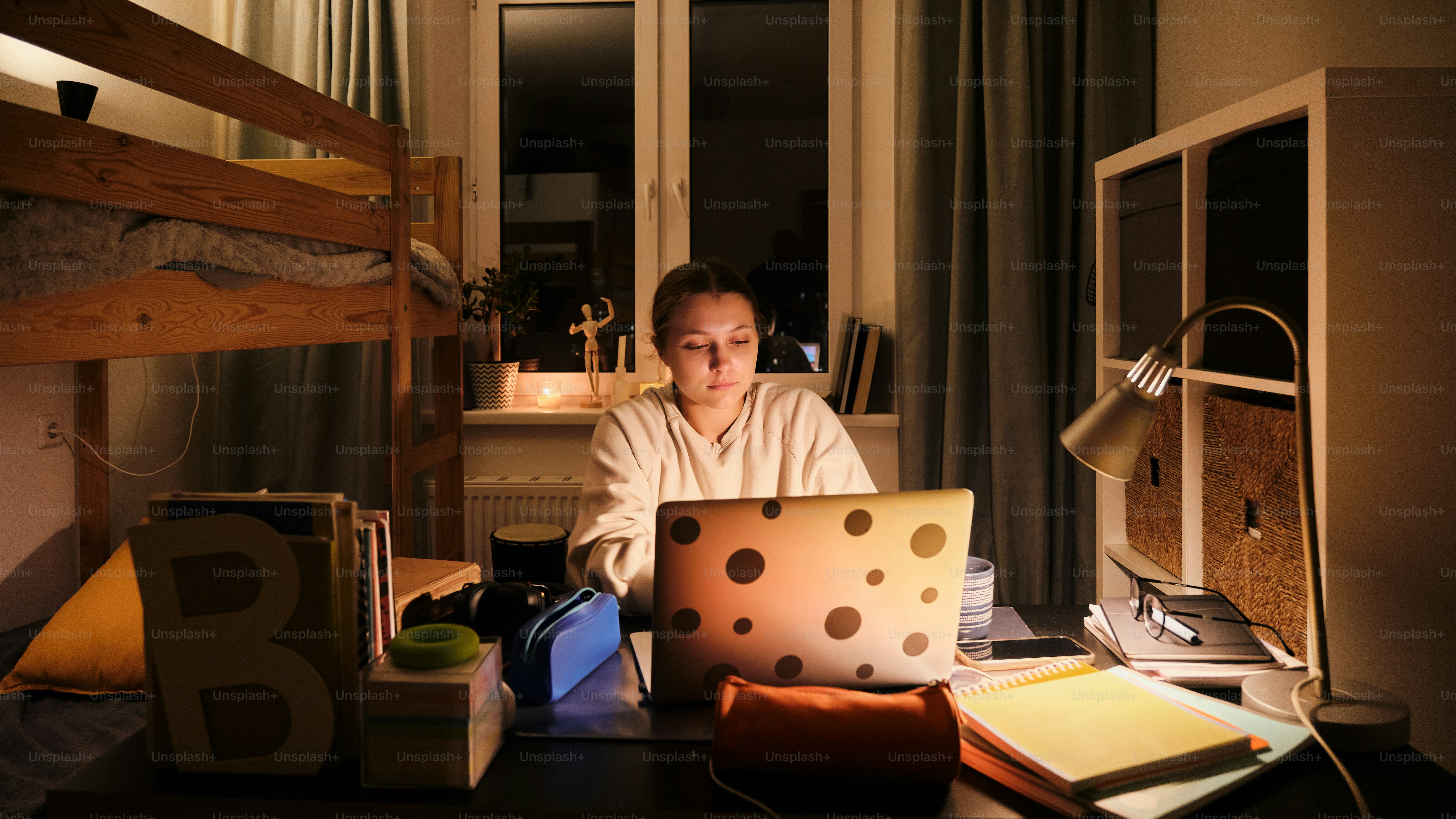 A man sitting in front of a laptop computer