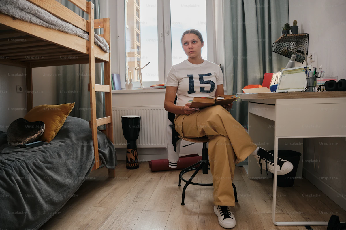 Traveller relaxing in a shared bunk room