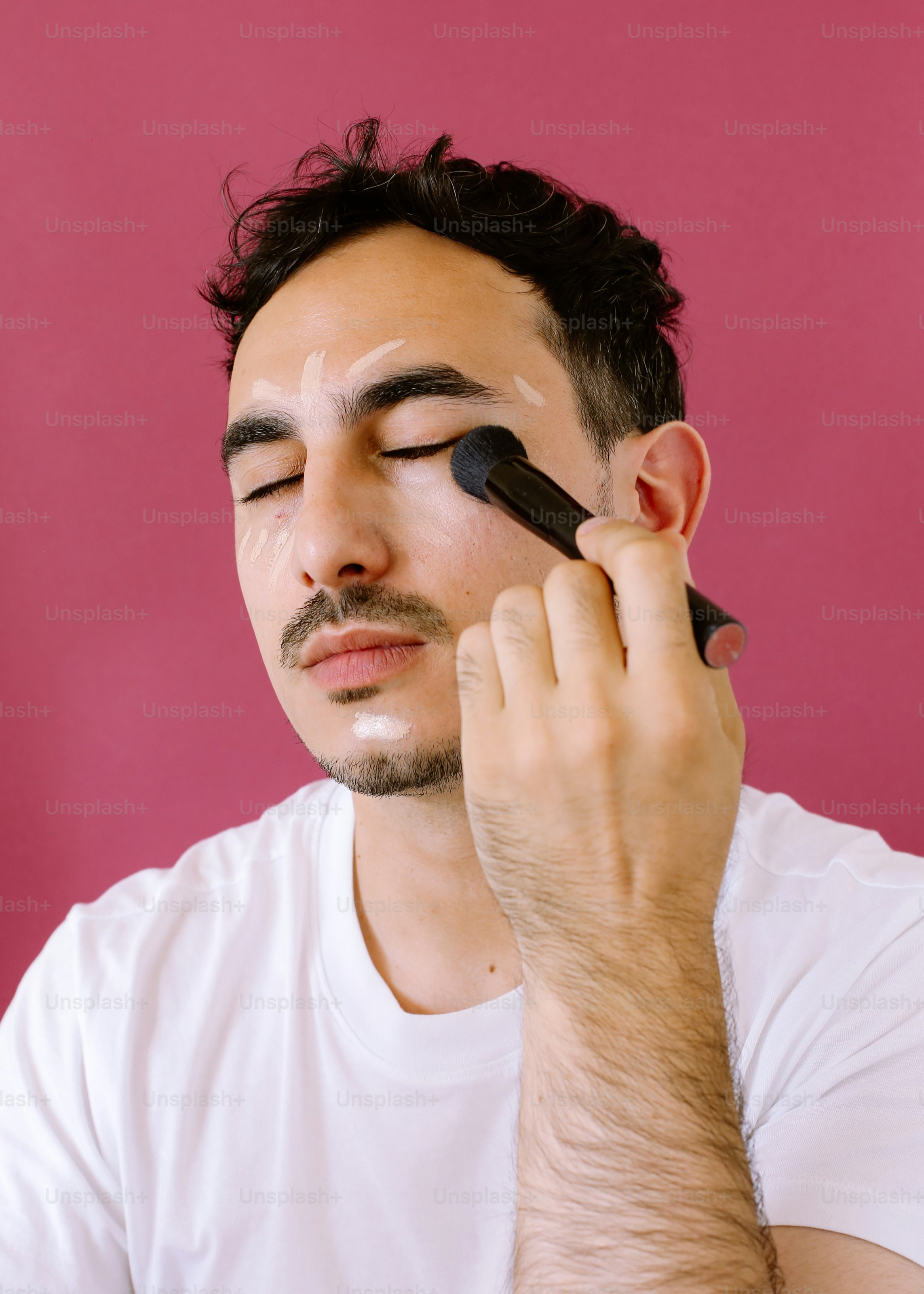 A man holding a cell phone up to his face
