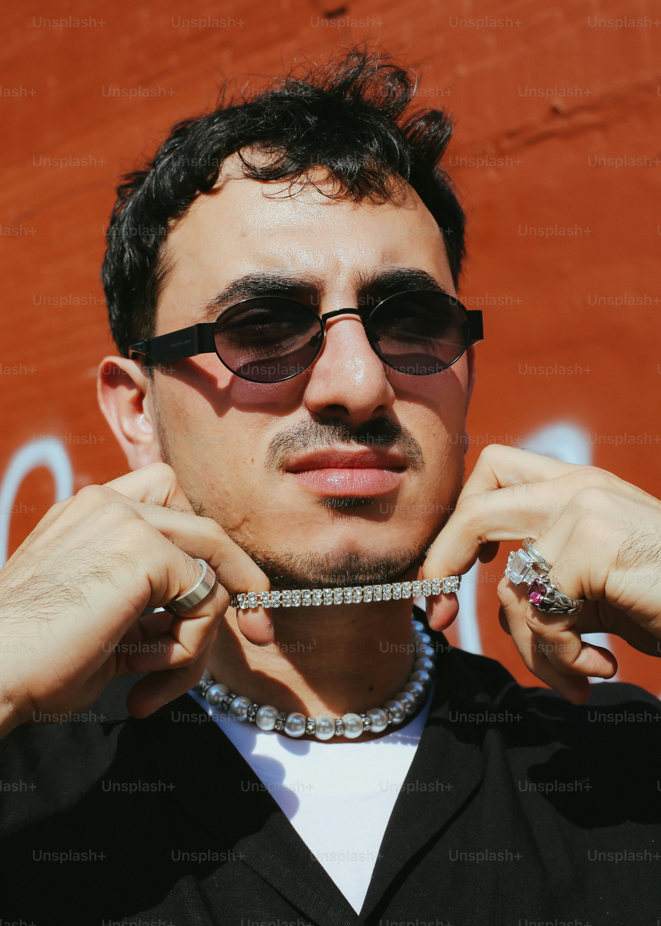 A man wearing a black shirt and sunglasses