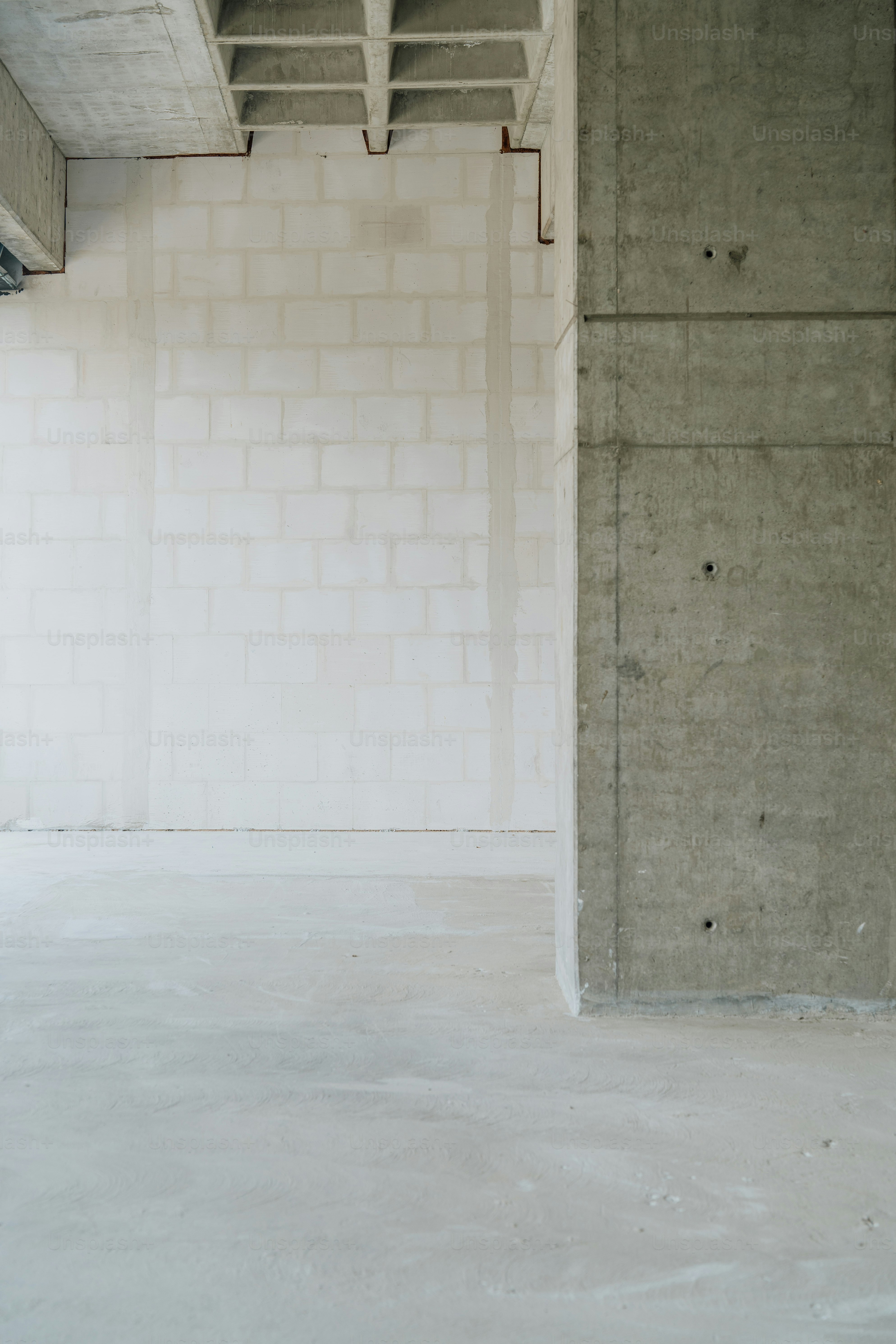 A person riding a skateboard in a parking garage