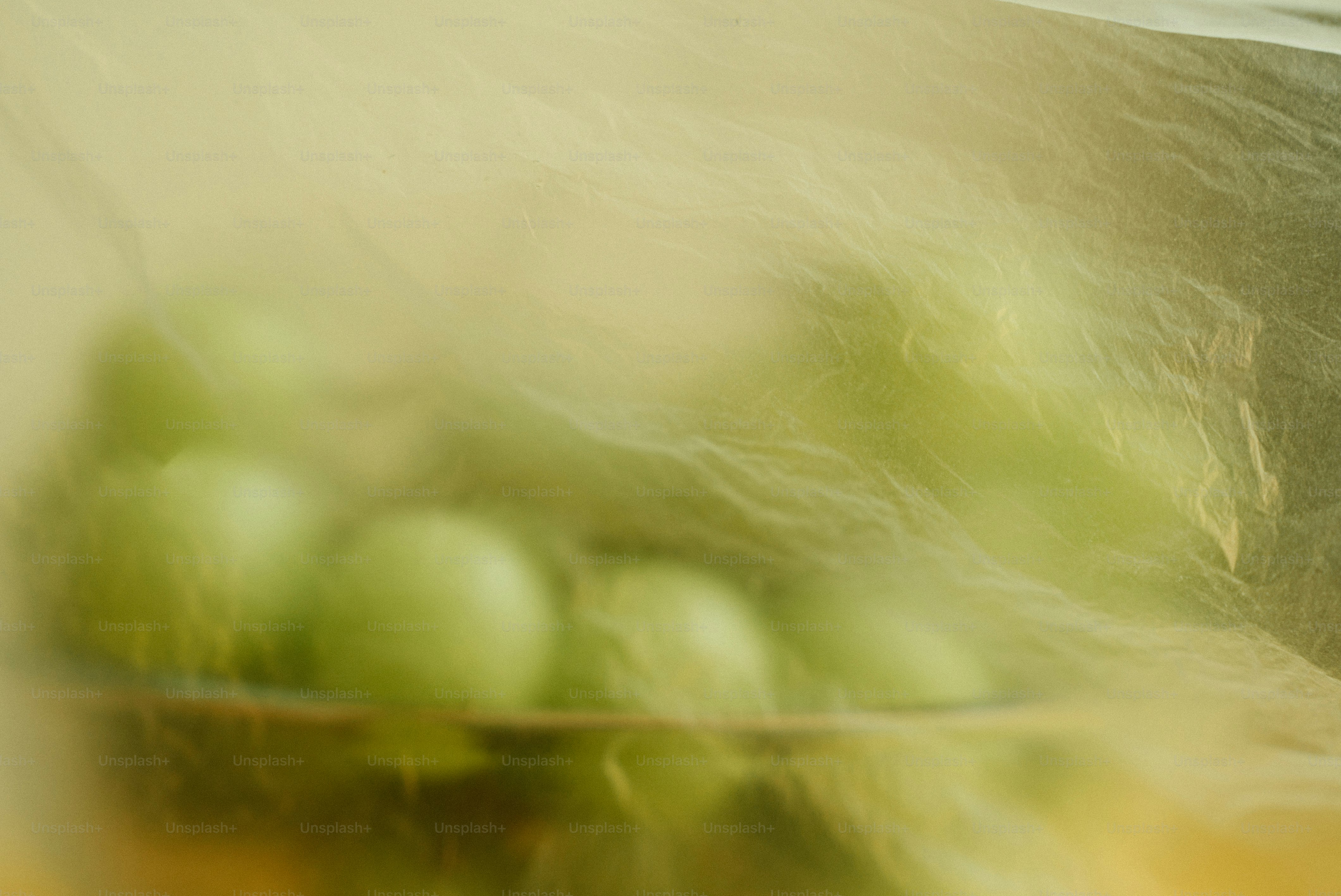 A blurry photo of a bowl of grapes