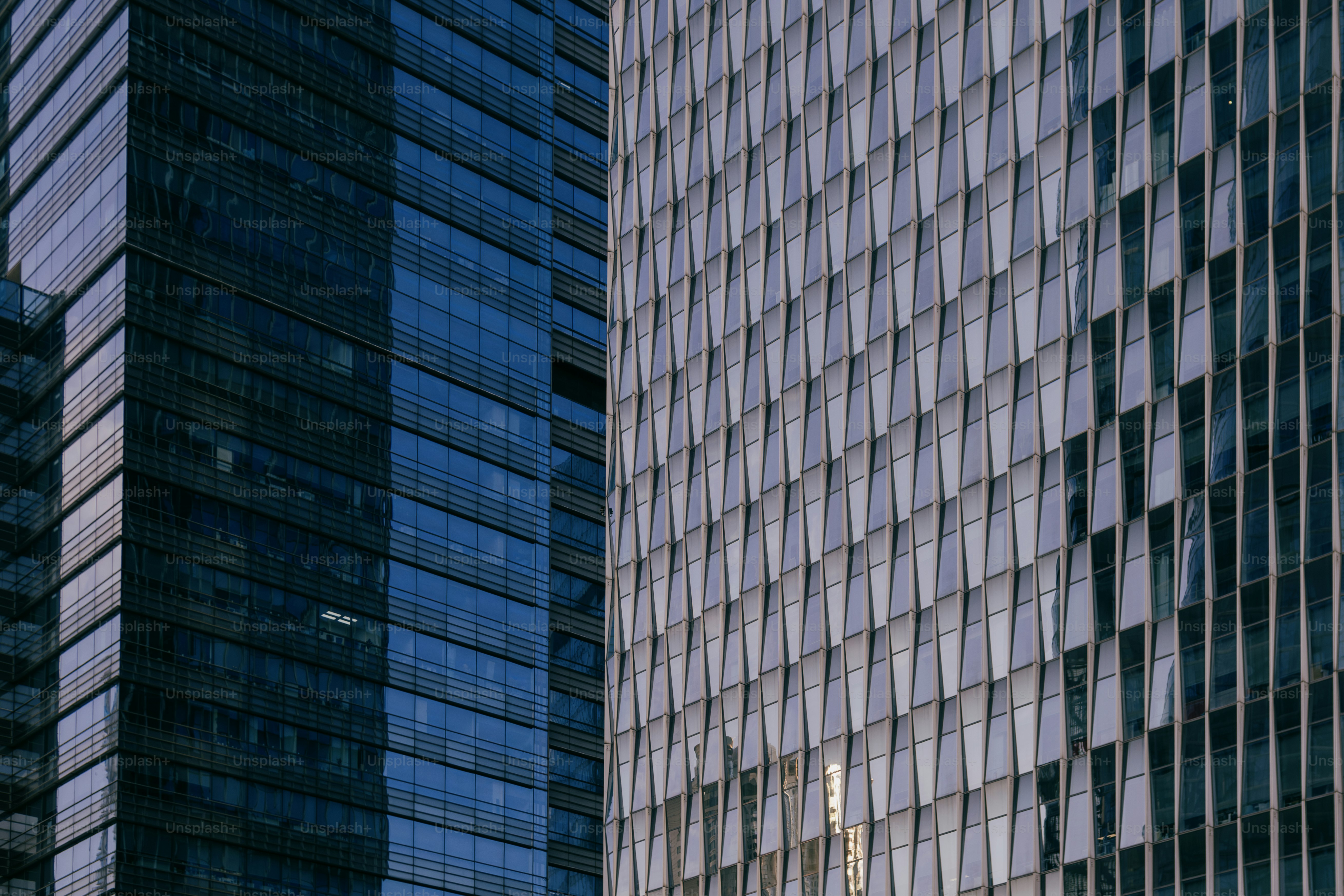 A couple of tall buildings next to each other