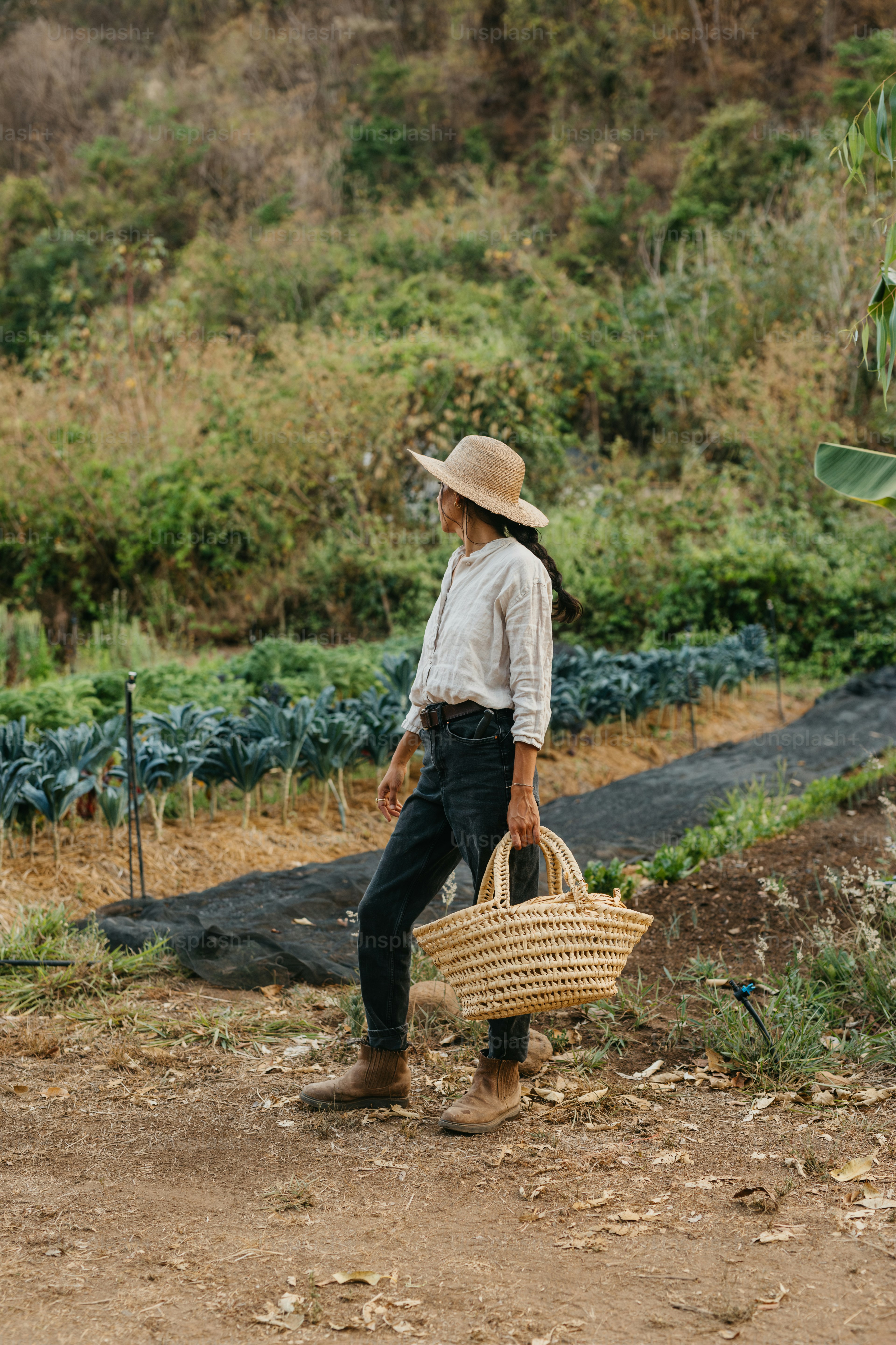 A man with a straw hat carrying a basket
