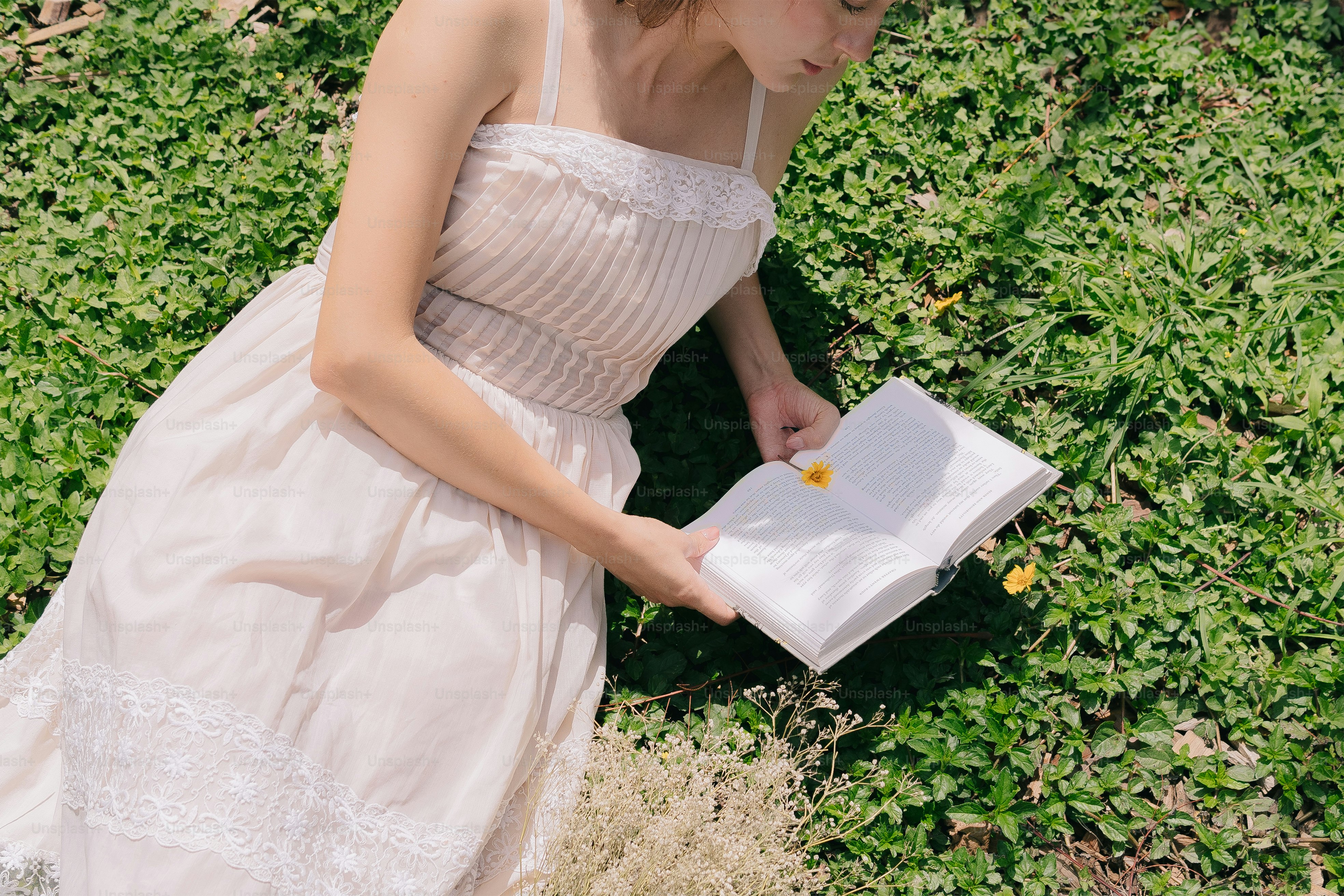 A woman in a white dress standing in front of a tree photo – Woman ...