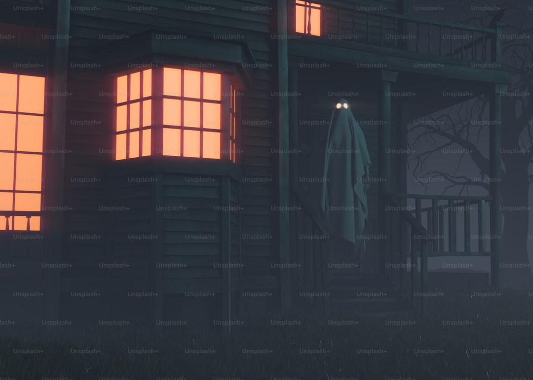 A creepy house with glowing windows at night