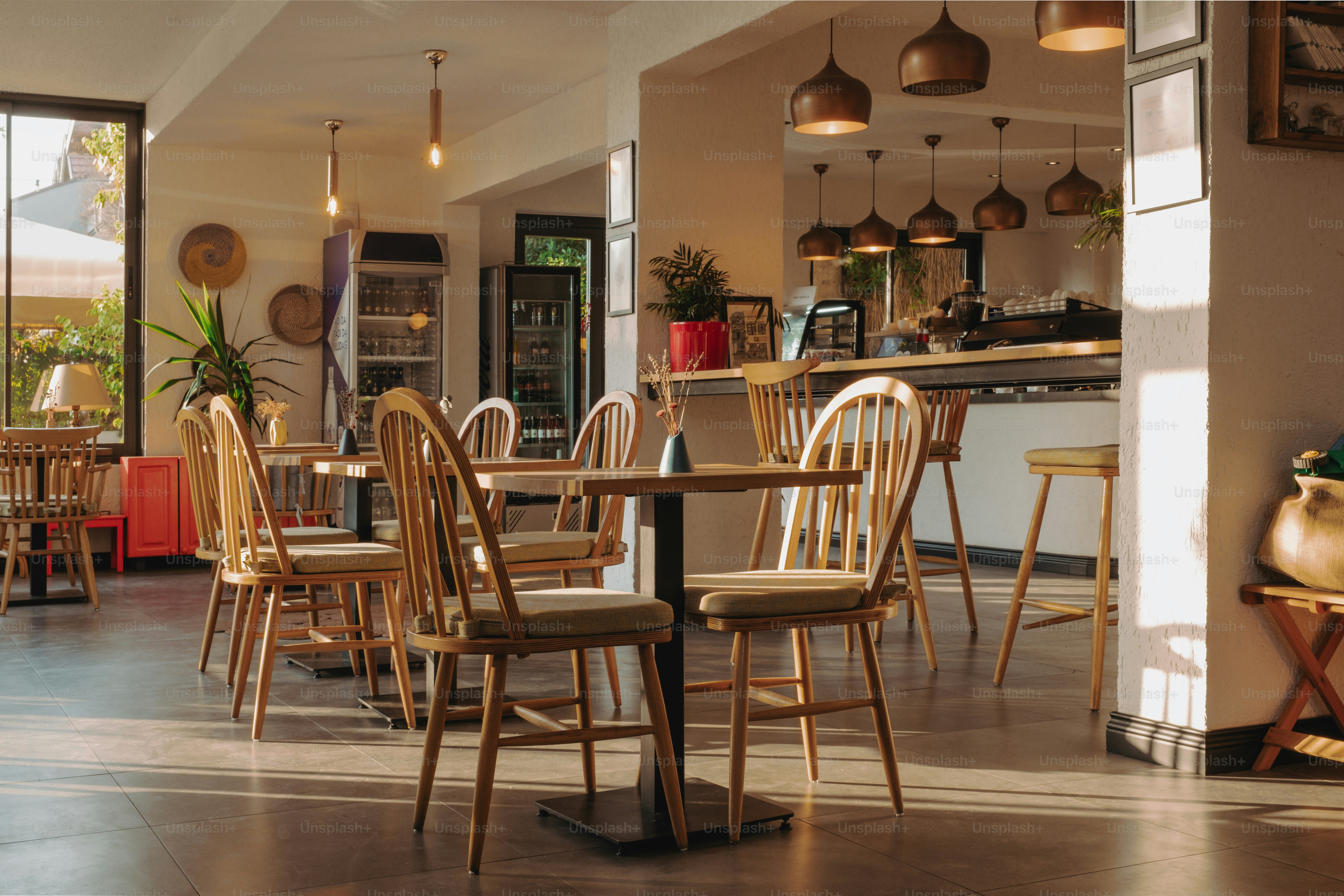 A dining room with a lot of chairs and tables