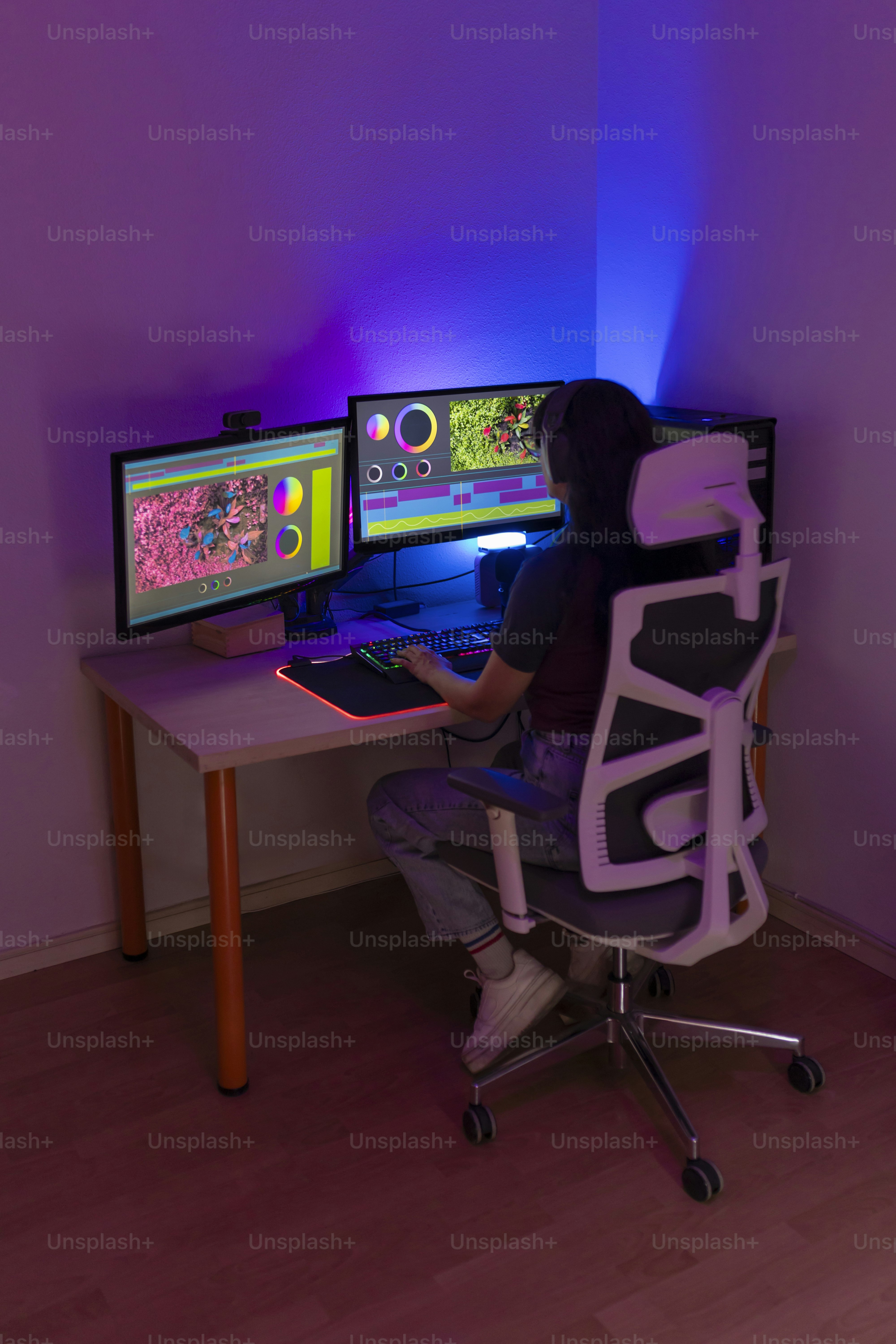 Neon gaming setup with keyboard and controller