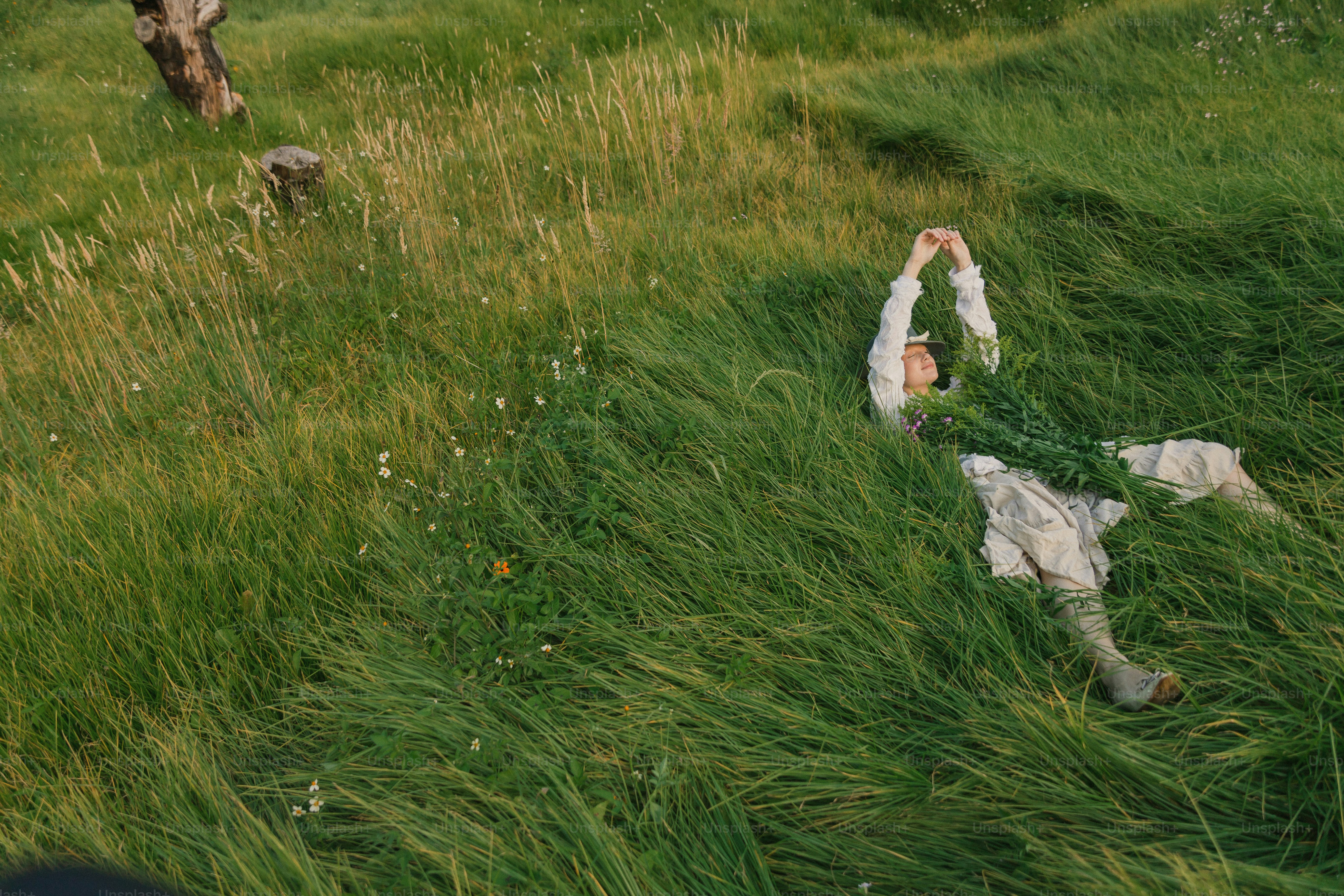 A group of people walking through a lush green field