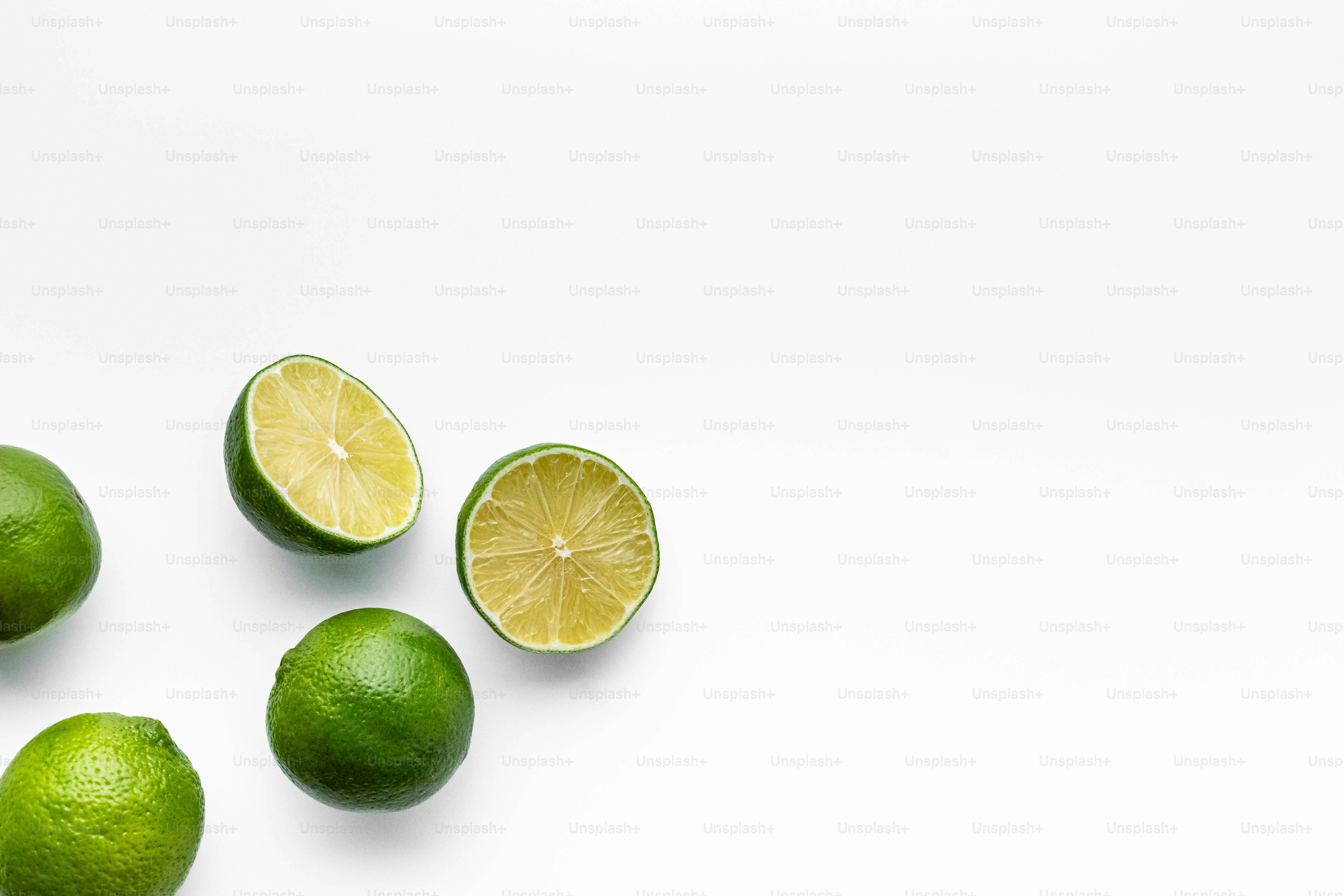 A group of limes on a white background