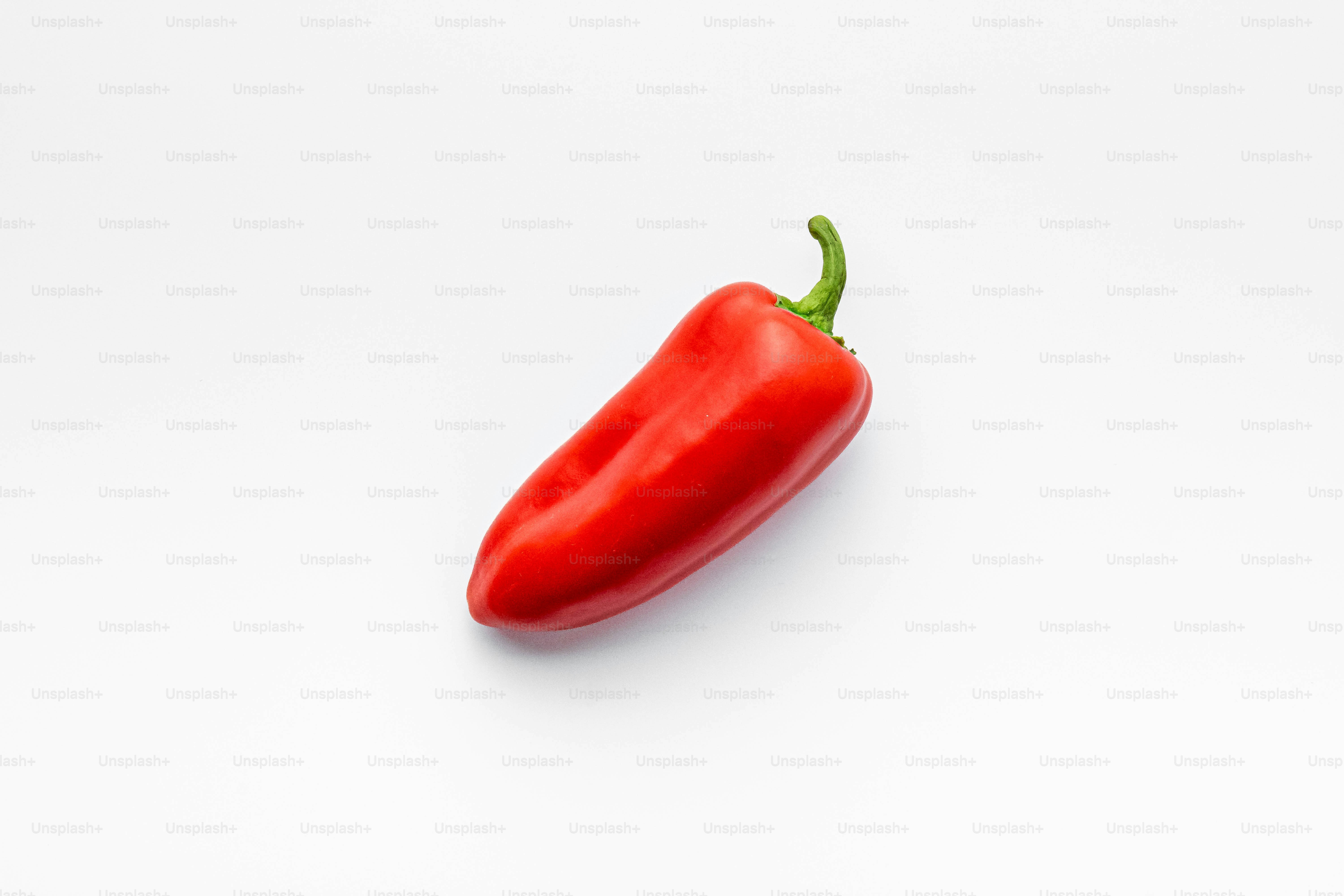 A red pepper on a white background
