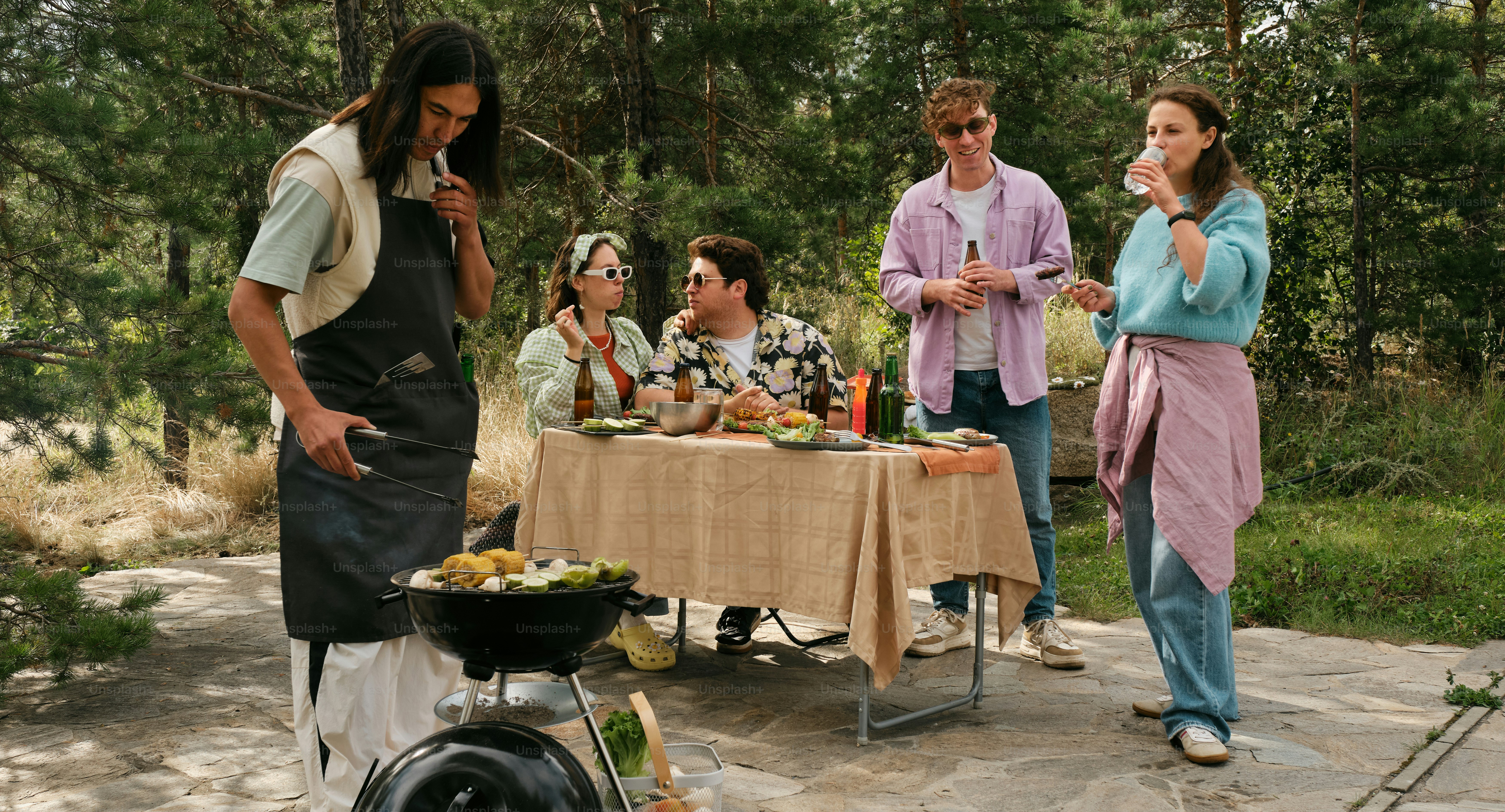 A group of people standing around a table