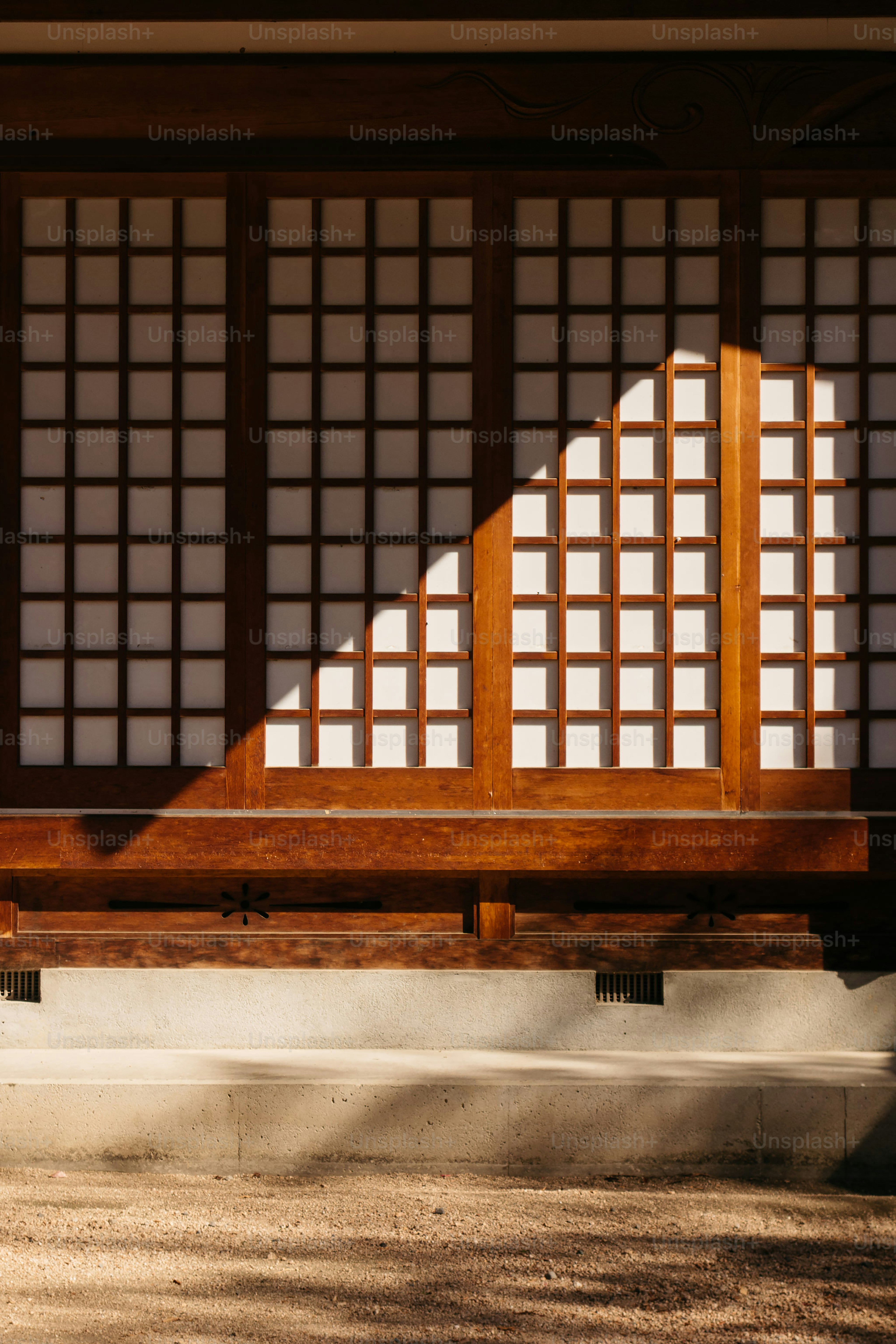 A wooden bench sitting in front of a building