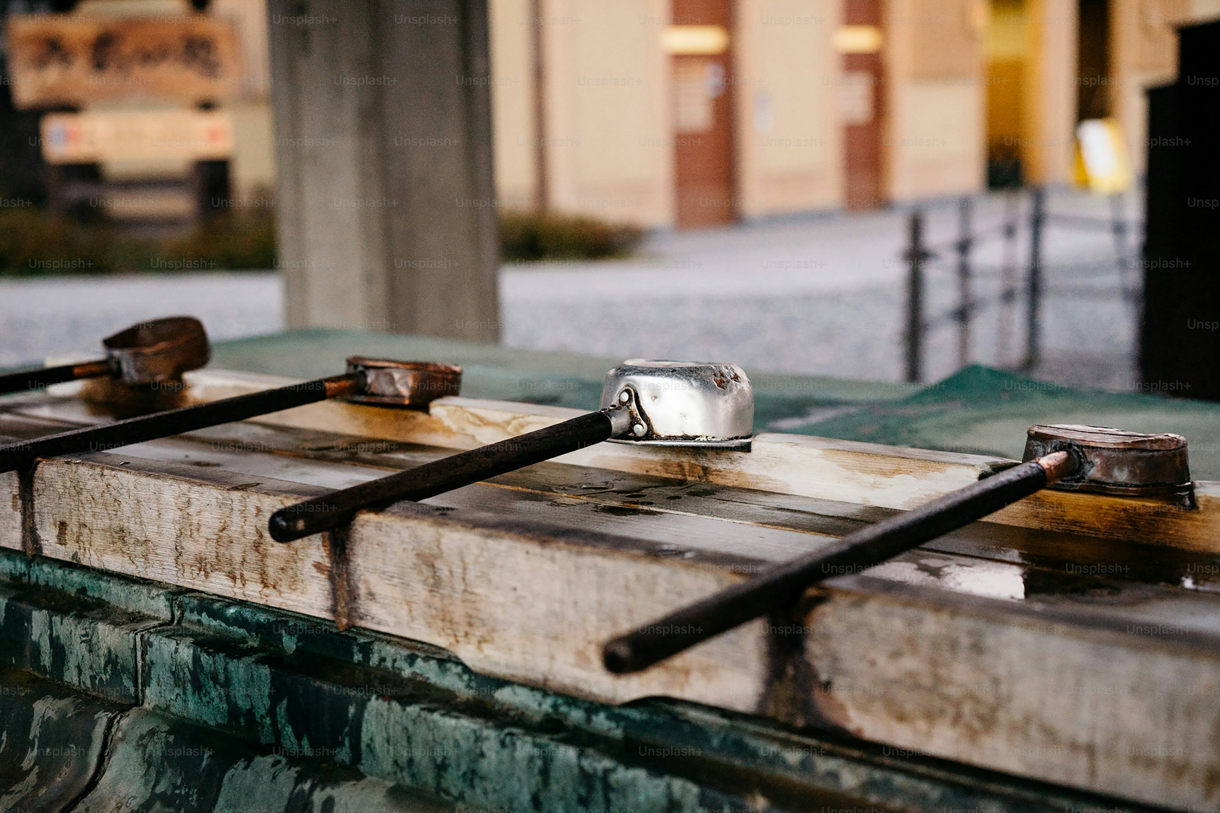 A close up of a metal object on a street